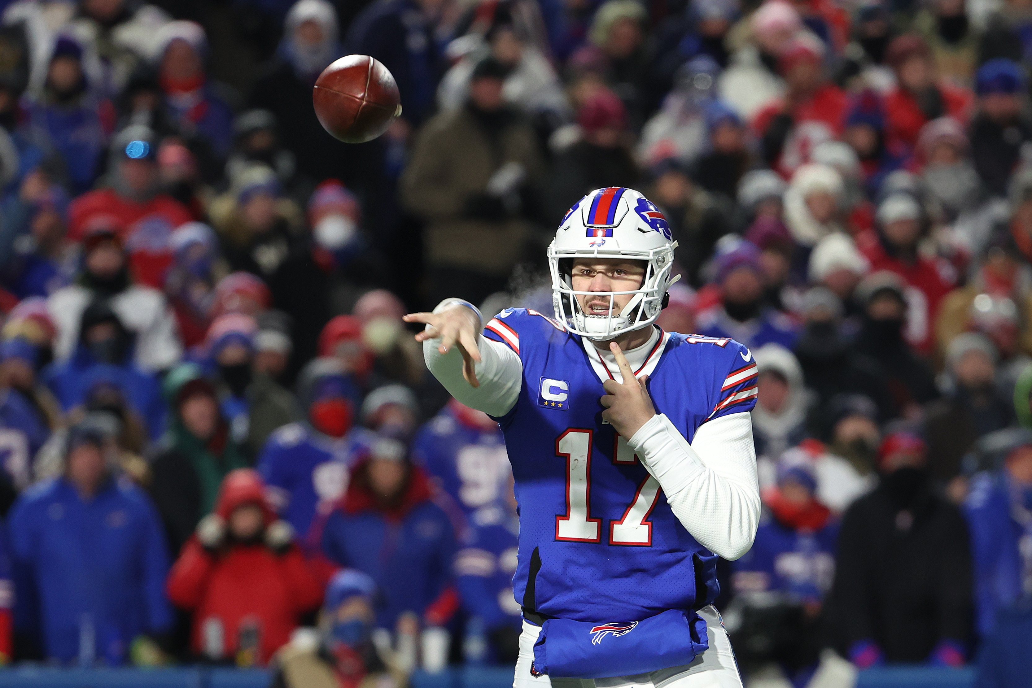 Josh Allen #17 of the Buffalo Bills throws a pass against the New England Patriots during the second quarter in the AFC Wild Card playoff game at Highmark Stadium on January 15, 2022 in Buffalo, New York.