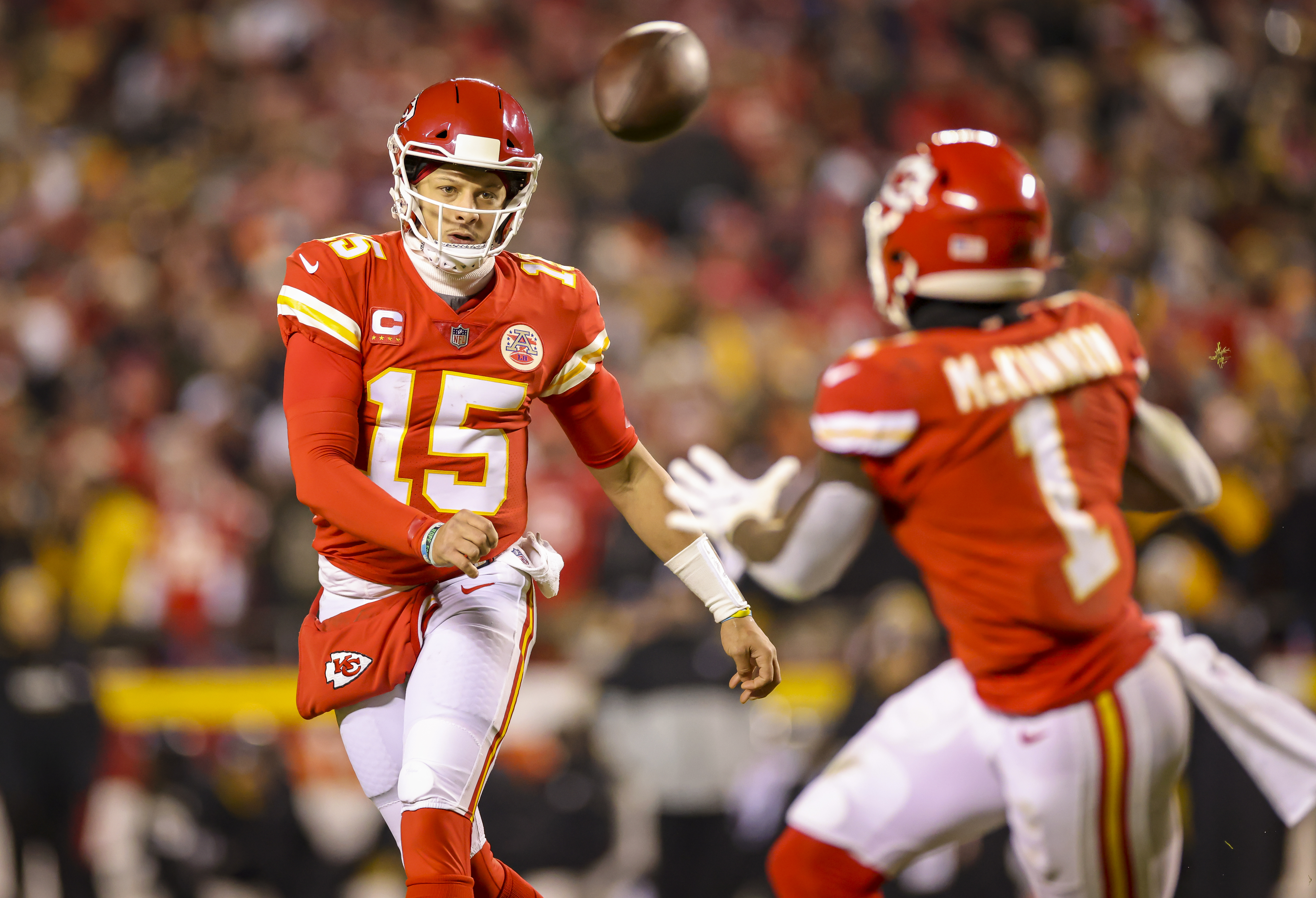 Patrick Mahomes #15 of the Kansas City Chiefs throws a completed pass to Jerick McKinnon #1 of the Kansas City Chiefs in the first quarter against the Pittsburgh Steelers during the AFC Wild Card Playoff game at Arrowhead Stadium on January 16, 2022 in Kansas City, Missouri.