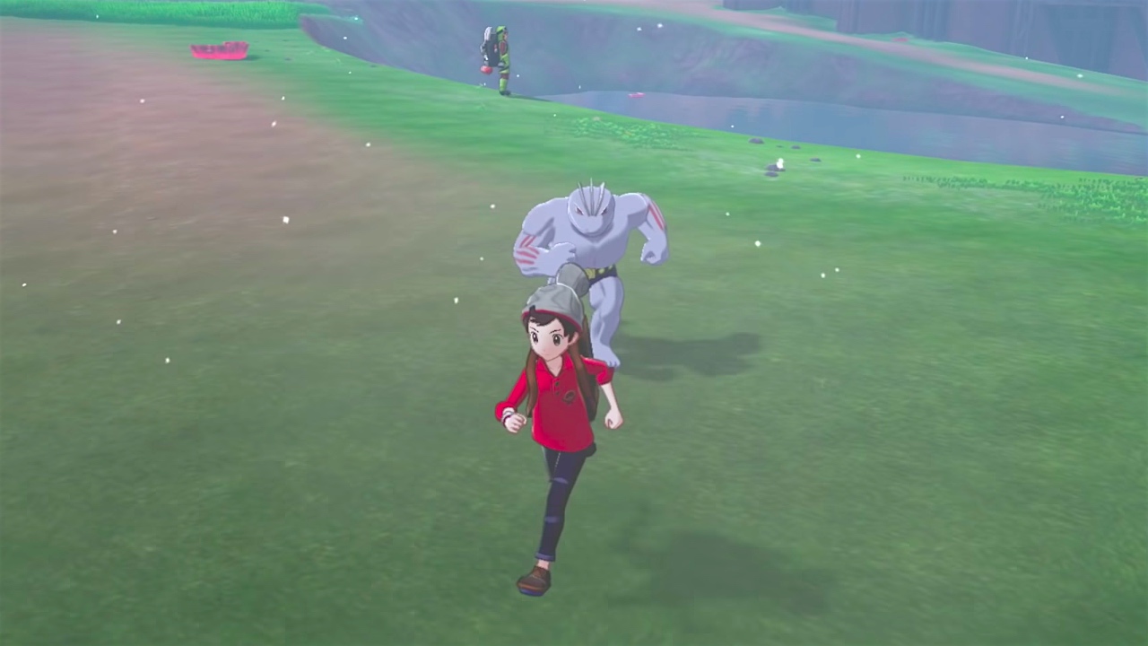 a machoke chasing a trainer in pokemon sword and shield