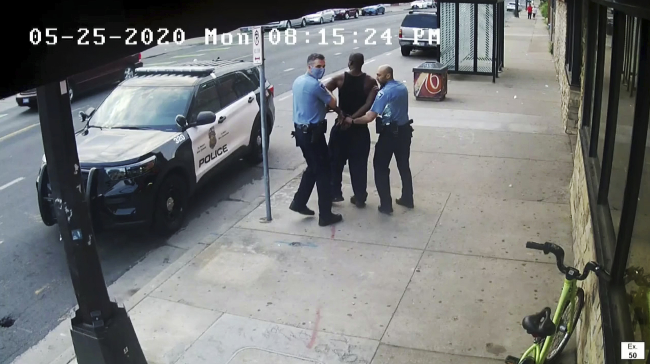 This image from video shows Minneapolis police Officers Thomas Lane, left and J. Alexander Kueng, right, escorting George Floyd to a police vehicle outside Cup Foods in Minneapolis, on May 25, 2020. Derek Chauvin, who has already been convicted of state murder and manslaughter charges in the death of Floyd, appears to be on the verge of pleading guilty to violating Floyd’s civil rights. Chauvin, Lane, Kueng and Tou Thao were set to go to trial in late January 2022 on those federal charges.
