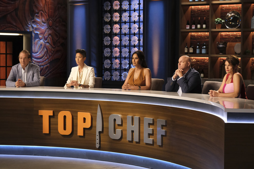 Judges sitting at the Top Chef desk.
