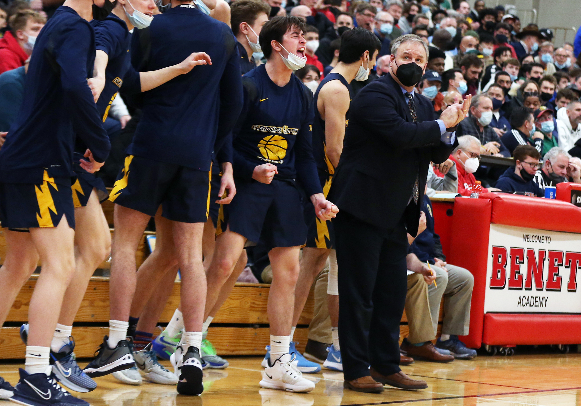 Glenbrook South coach Phil Ralston applauds the effort of the Titans’ players as they close in on a 57-54 victory over Simeon.