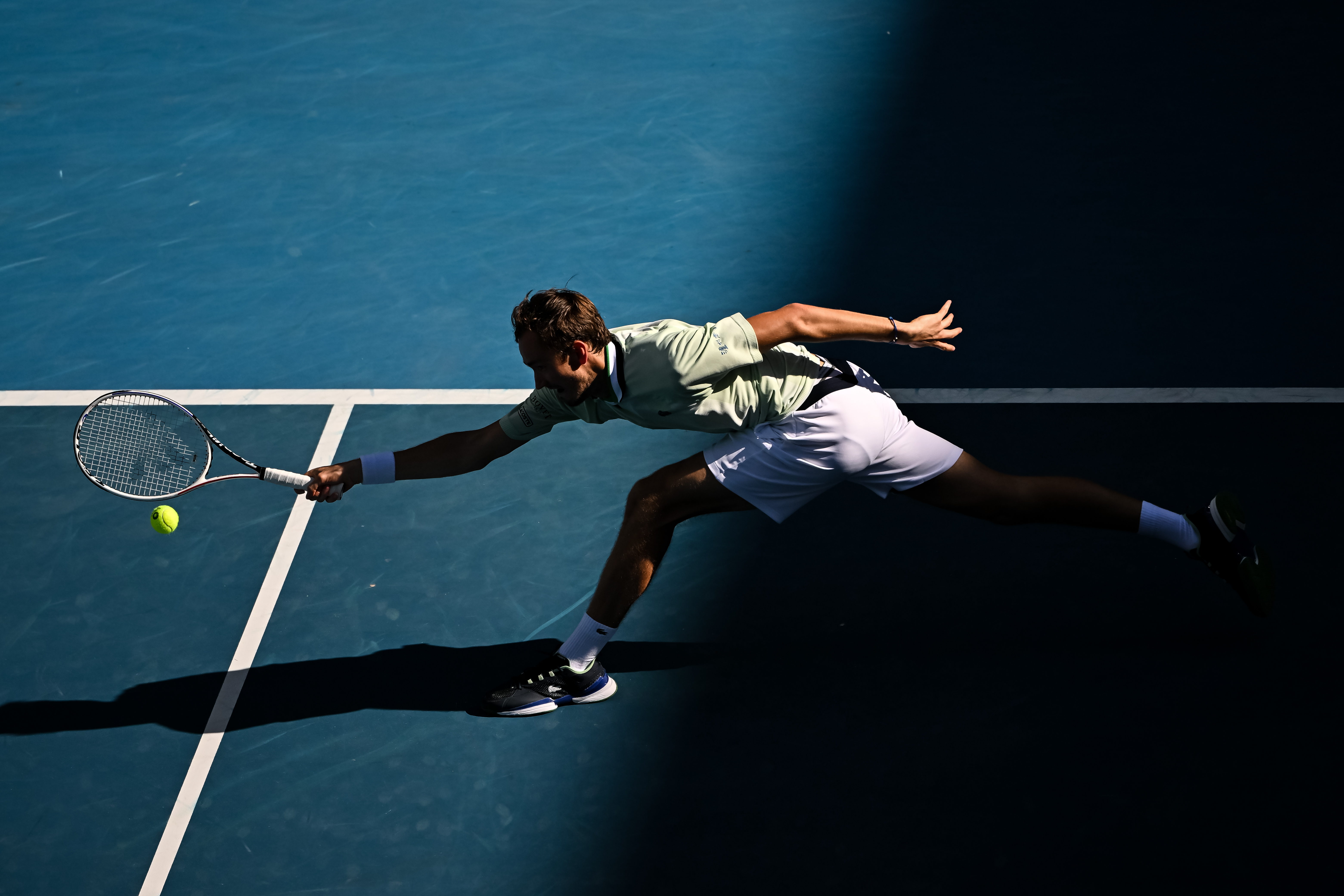 Daniil Medvedev of Russia hits a forehand against Maxime Cressy of the United States during day eight of the 2022 Australian Open at Melbourne Park on January 24, 2022 in Melbourne, Australia.