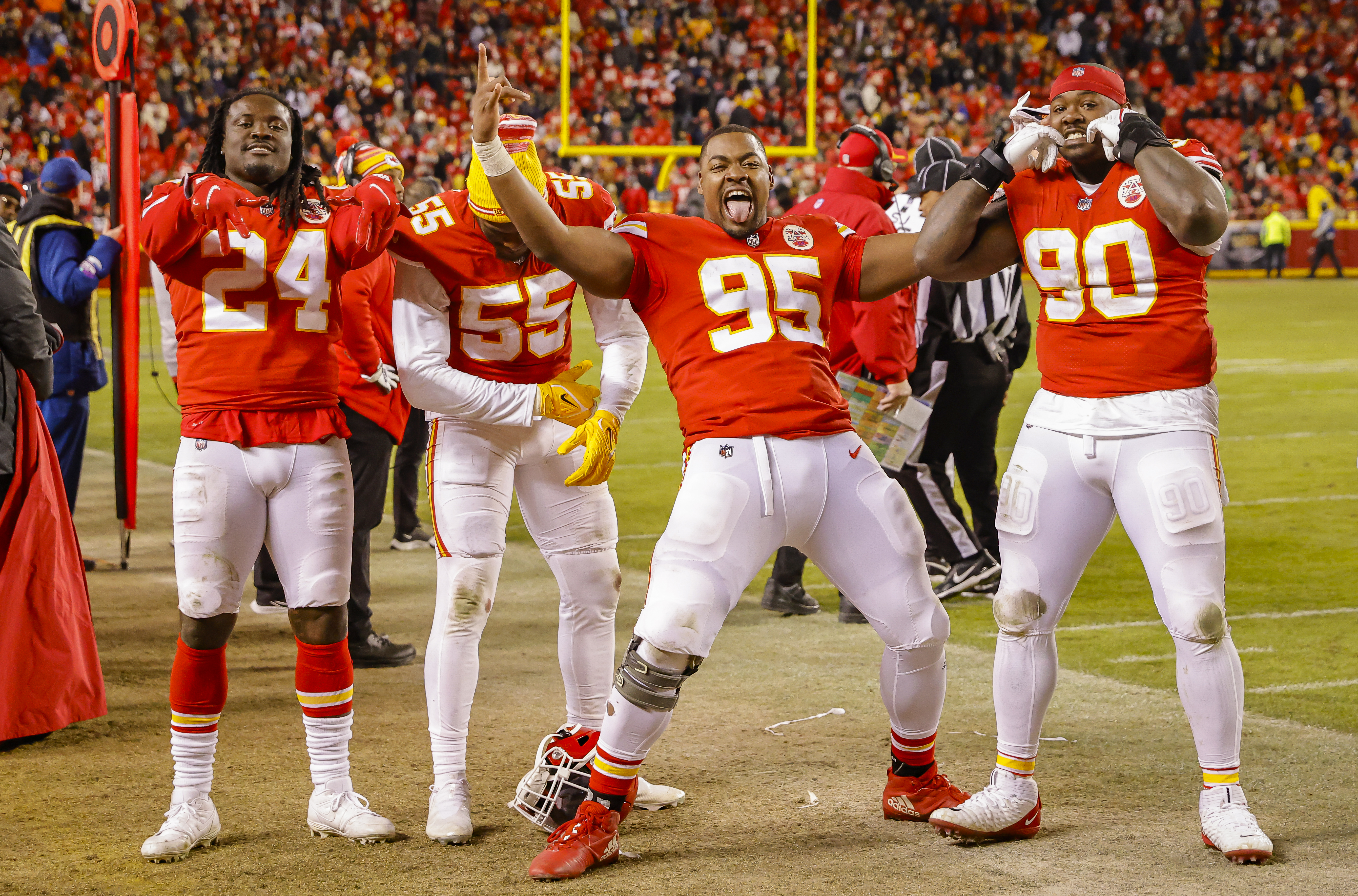 Melvin Ingram #24 of the Kansas City Chiefs, Chris Jones #95 of the Kansas City Chiefs and Jarran Reed #90 of the Kansas City Chiefs react to the 42-21 victory over the Pittsburgh Steelers during the AFC Wild Card Playoff game at Arrowhead Stadium on January 16, 2022 in Kansas City, Missouri.