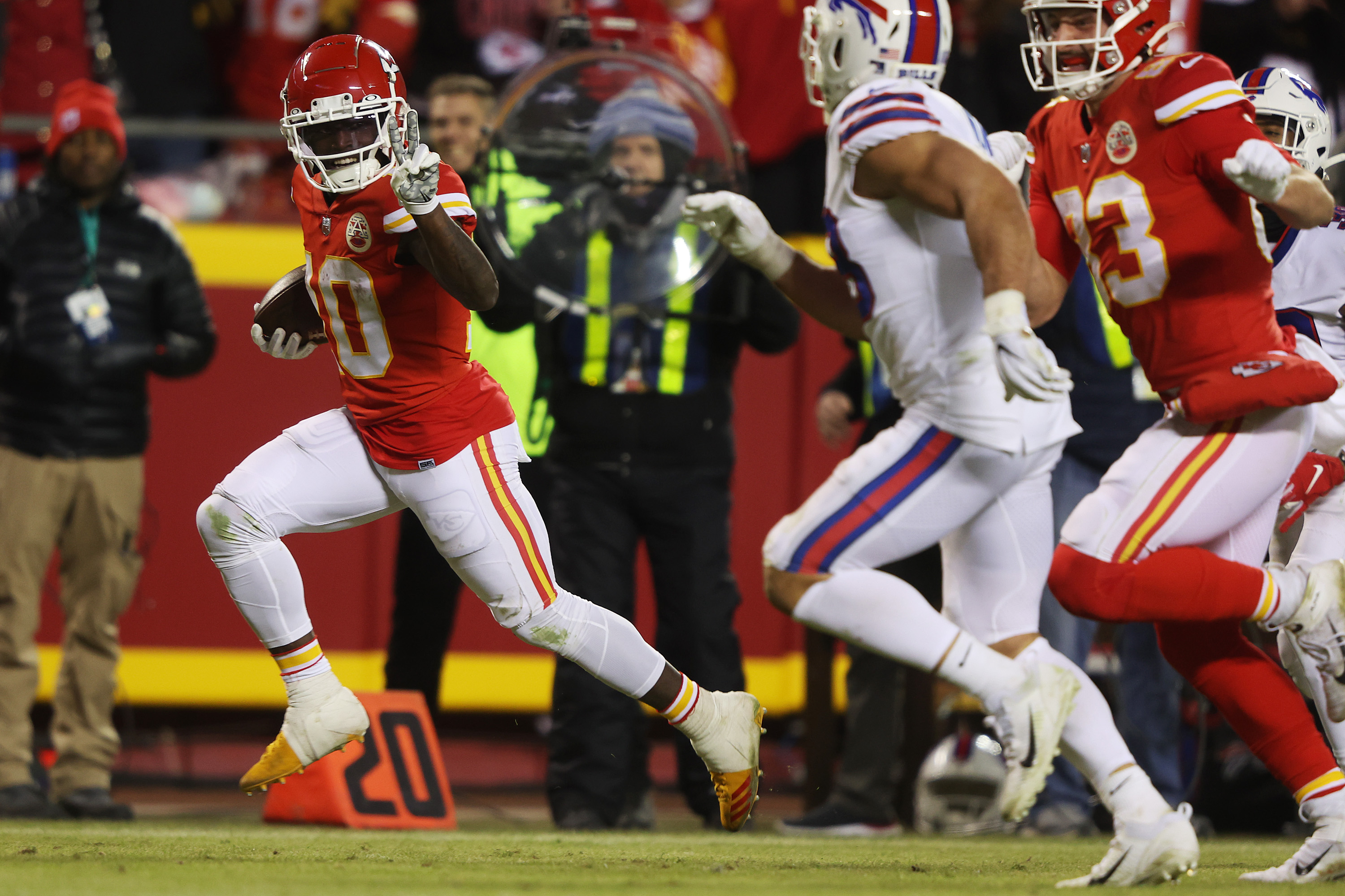 Tyreek Hill #10 of the Kansas City Chiefs scores a 64 yard touchdown against the Buffalo Bills during the fourth quarter in the AFC Divisional Playoff game at Arrowhead Stadium on January 23, 2022 in Kansas City, Missouri.