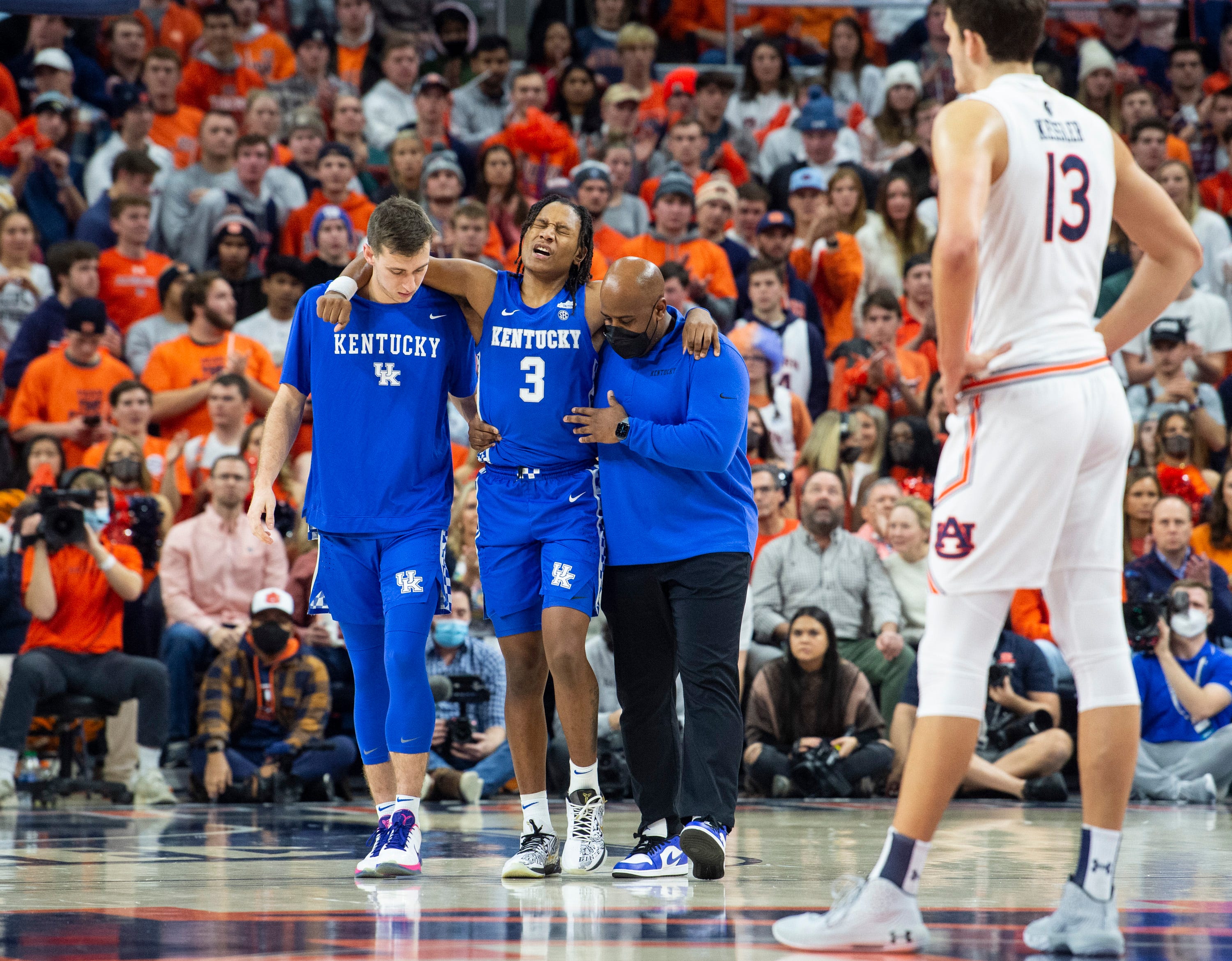 Kentucky Wildcats TyTy Washington Jr. is helped off the court with an injury as Auburn Tigers men’s basketball takes on Kentucky Wildcats at Auburn Arena in Auburn, Ala., on Saturday, Jan. 22, 2022.
