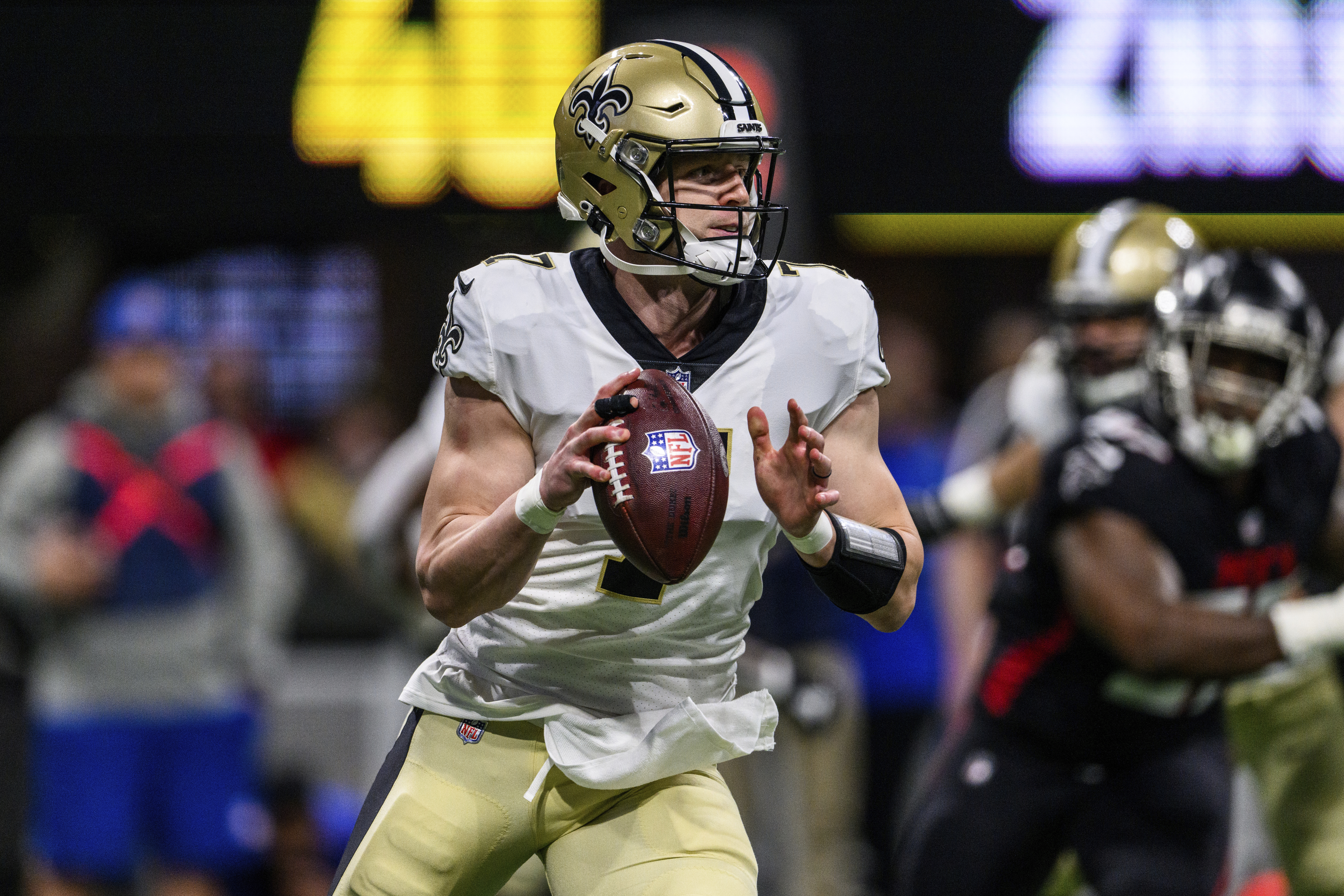 New Orleans Saints quarterback Taysom Hill works during the first half of a game against the Atlanta Falcons.