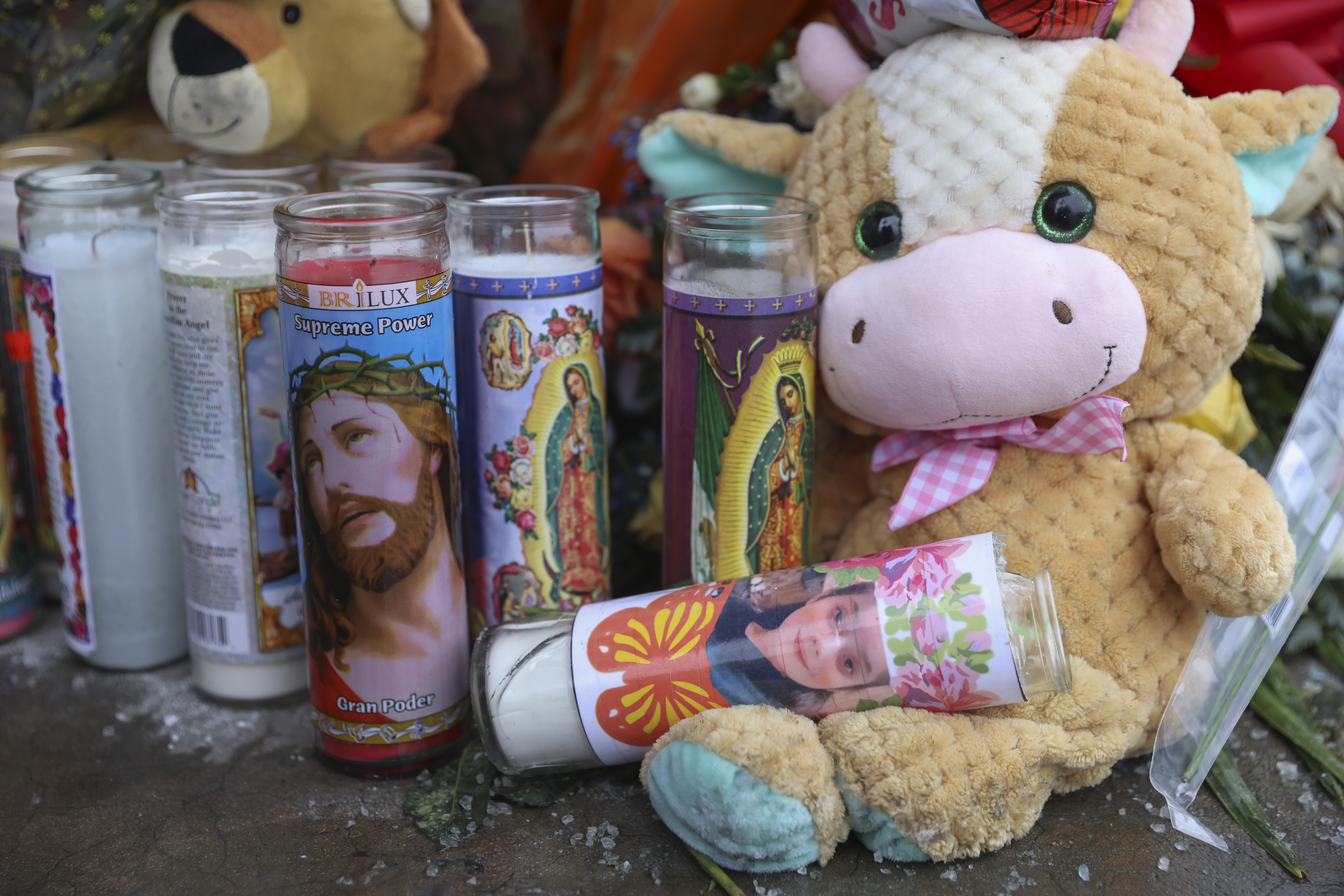 A candle with a photo of Melissa Ortega on its side at the memorial for 8-year-old Melissa Ortega at the corner of 26th Street and South Pulaski Road in Little Village, Monday Jan. 24, 2022. | Anthony Vazquez/Sun-Times