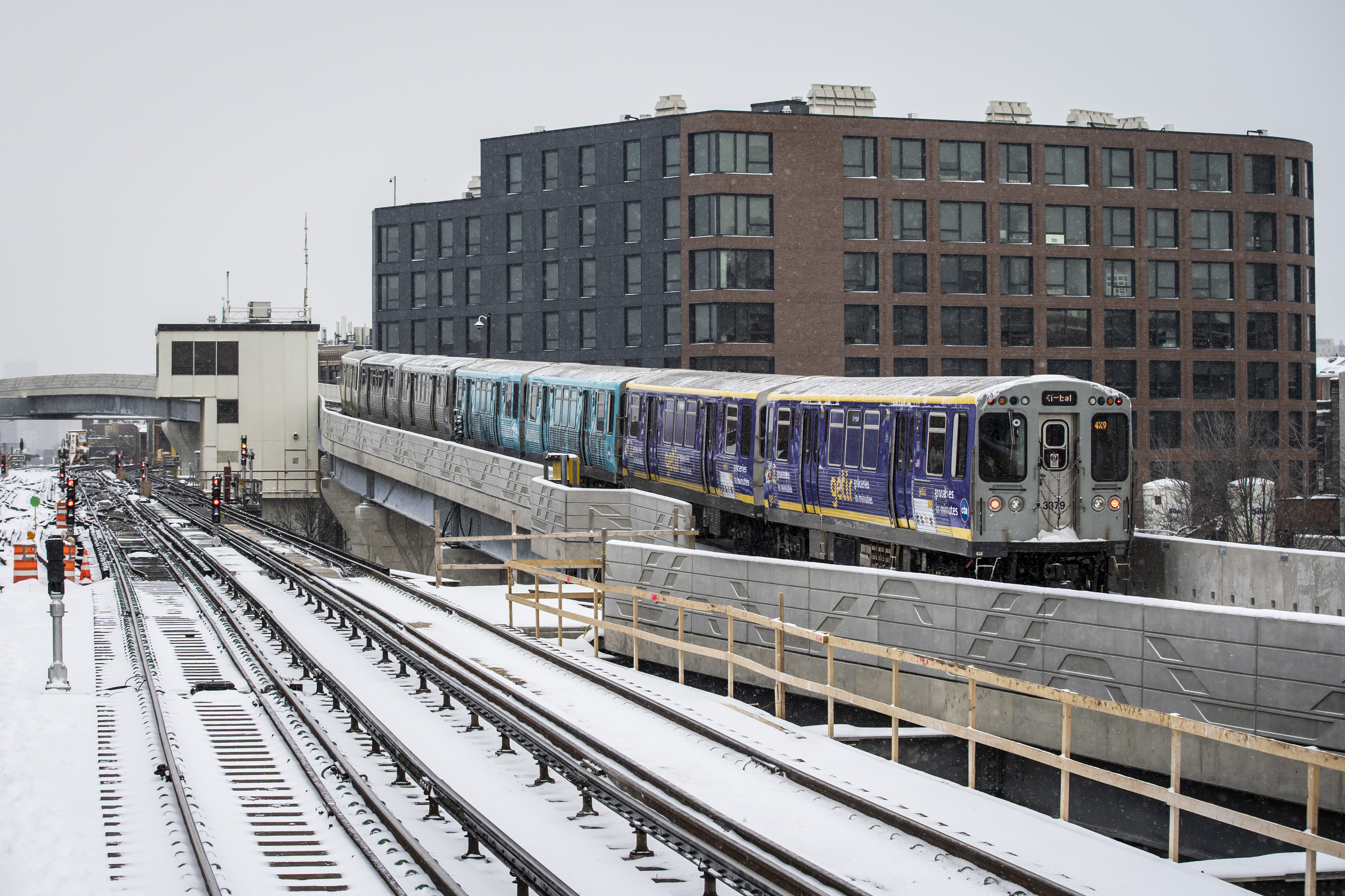A Brown Line train travels over the new CTA Red-Purple Bypass near the Belmont Station on the North Side, Monday morning, Jan. 24, 2022. 