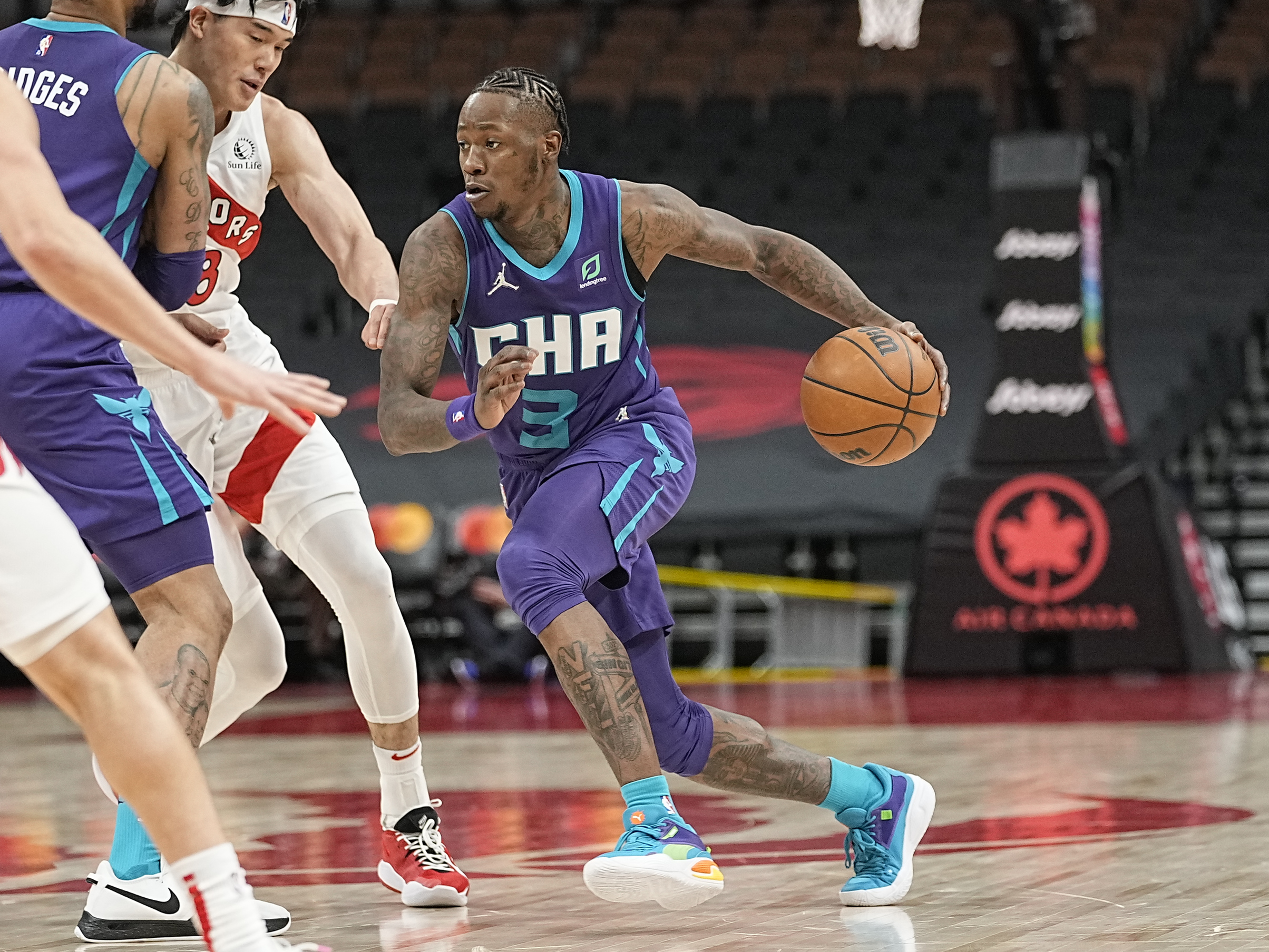 Charlotte Hornets guard Terry Rozier (3) drives to the basket against the Toronto Raptors during the first half at Scotiabank Arena.