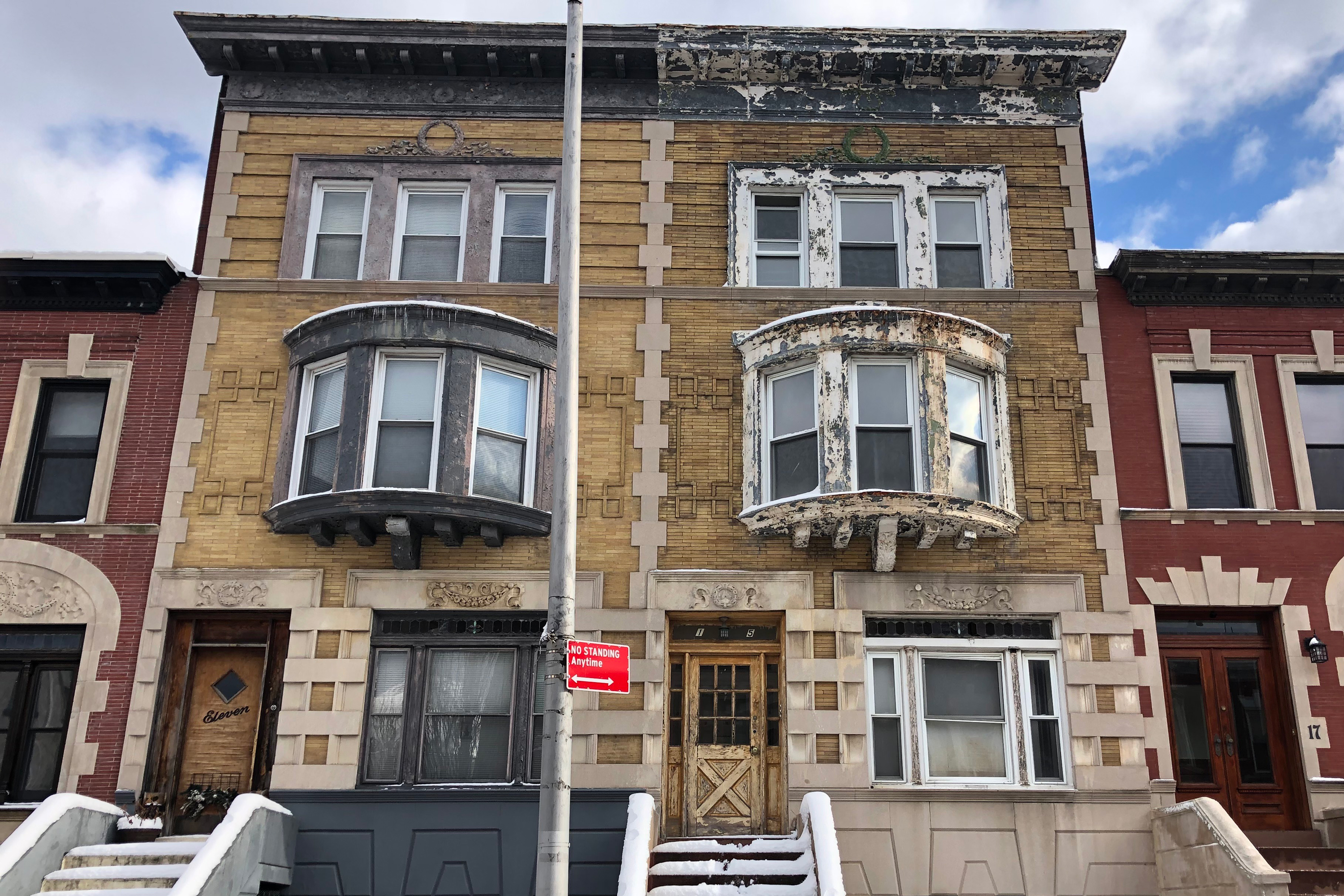 A vacant Crown Heights residential property, on right, was listed on the city’s lien sale list, Jan. 7, 2022.