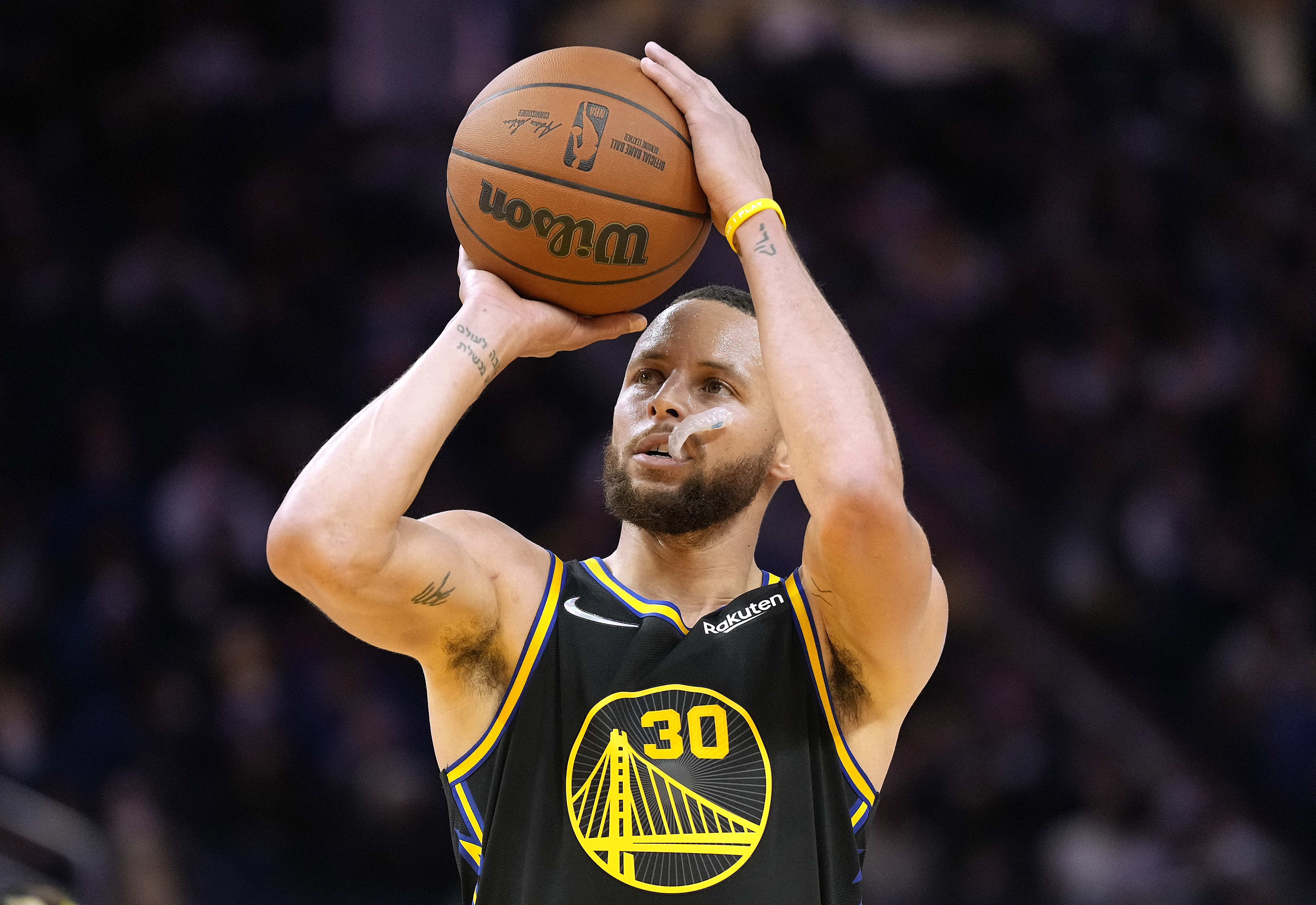 Stephen Curry #30 of the Golden State Warriors shoots a technical foul shot against the Dallas Mavericks during the second half of an NBA basketball game at Chase Center on January 25, 2022 in San Francisco, California.&nbsp;