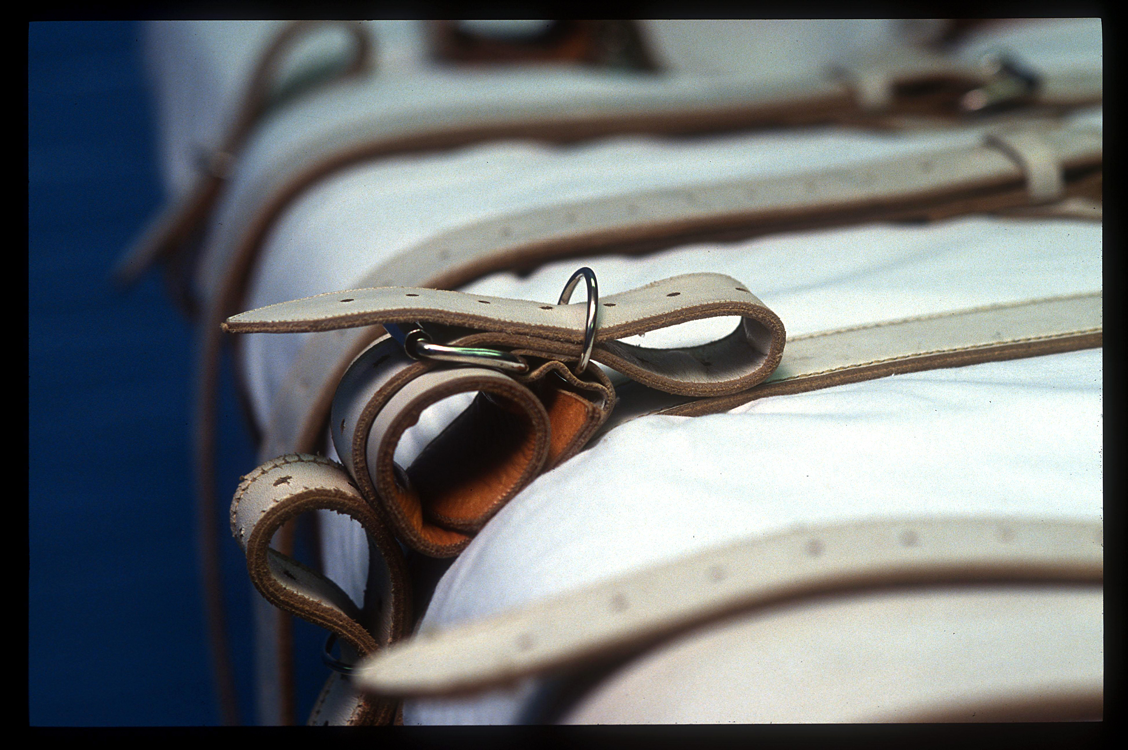 A close-up on the straps on a bed that will hold a prisoner receiving a lethal injection.