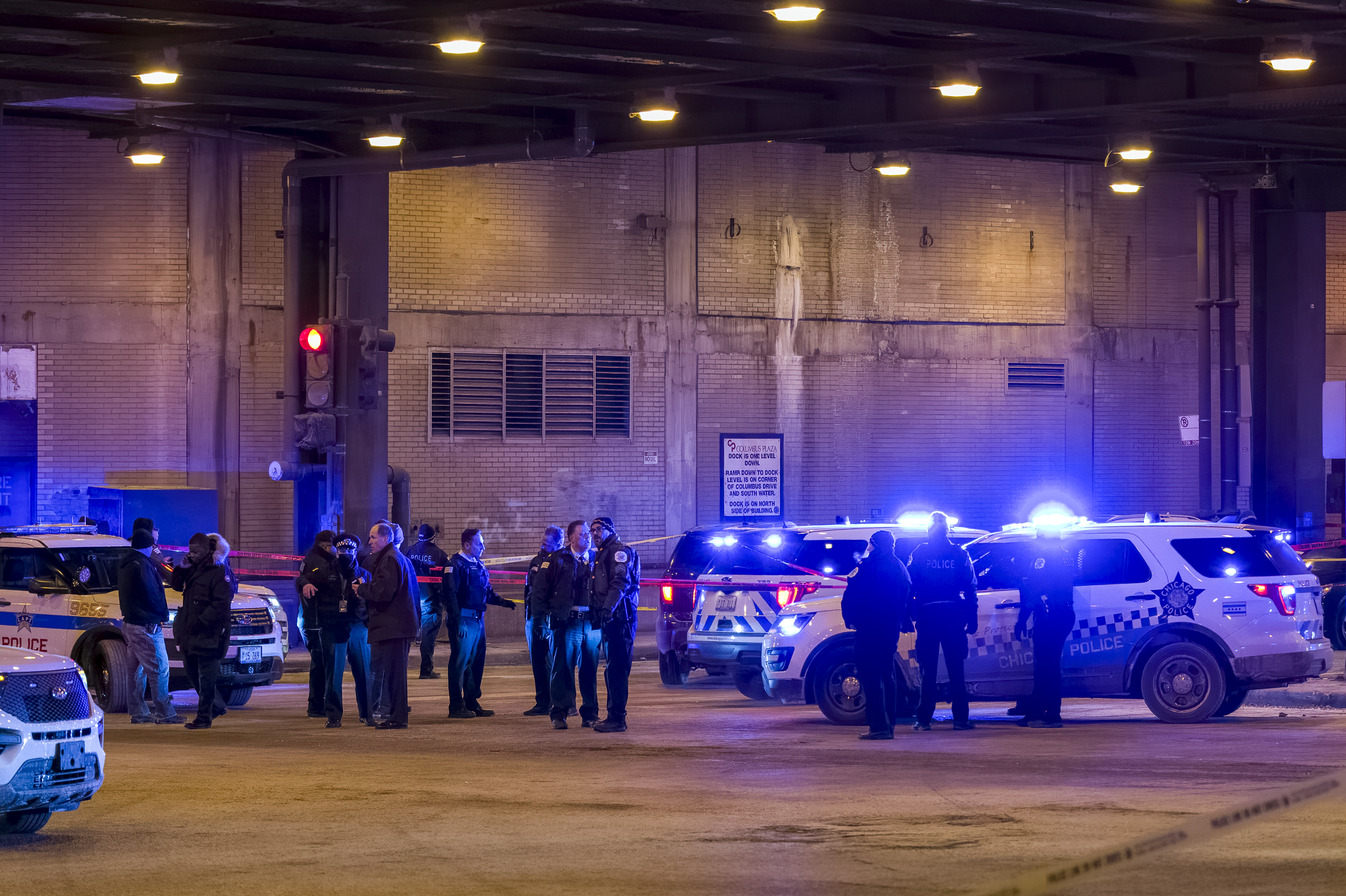 Chicago police work the scene where a man was shot in a “police-involved” shooting in the 200 block of E. Lower Wacker Drive, in The Loop neighborhood, Wednesday, Jan. 26, 2022.