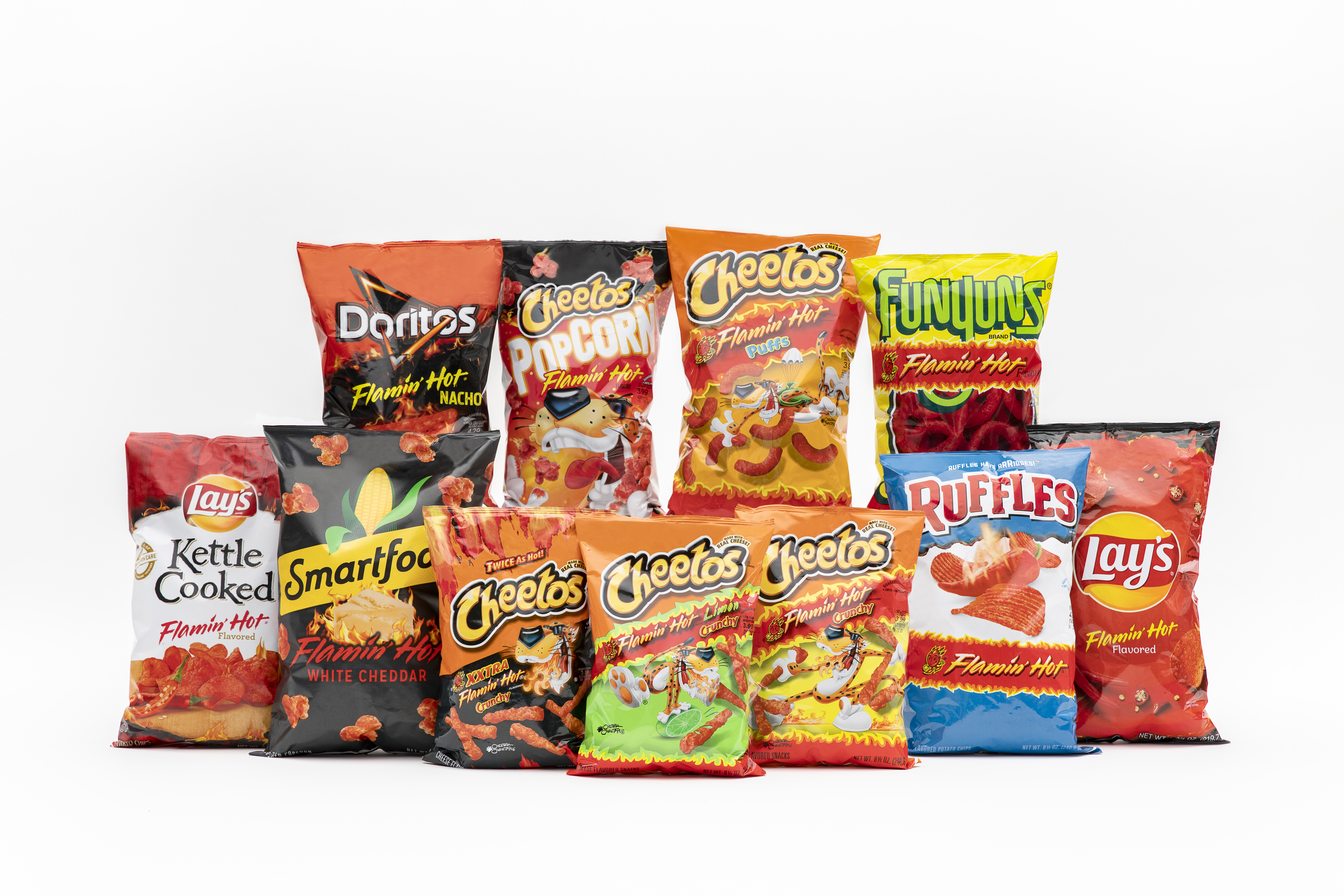 A selection of Flamin’ Hot products, including cheetos, funyuns, and ruffles.