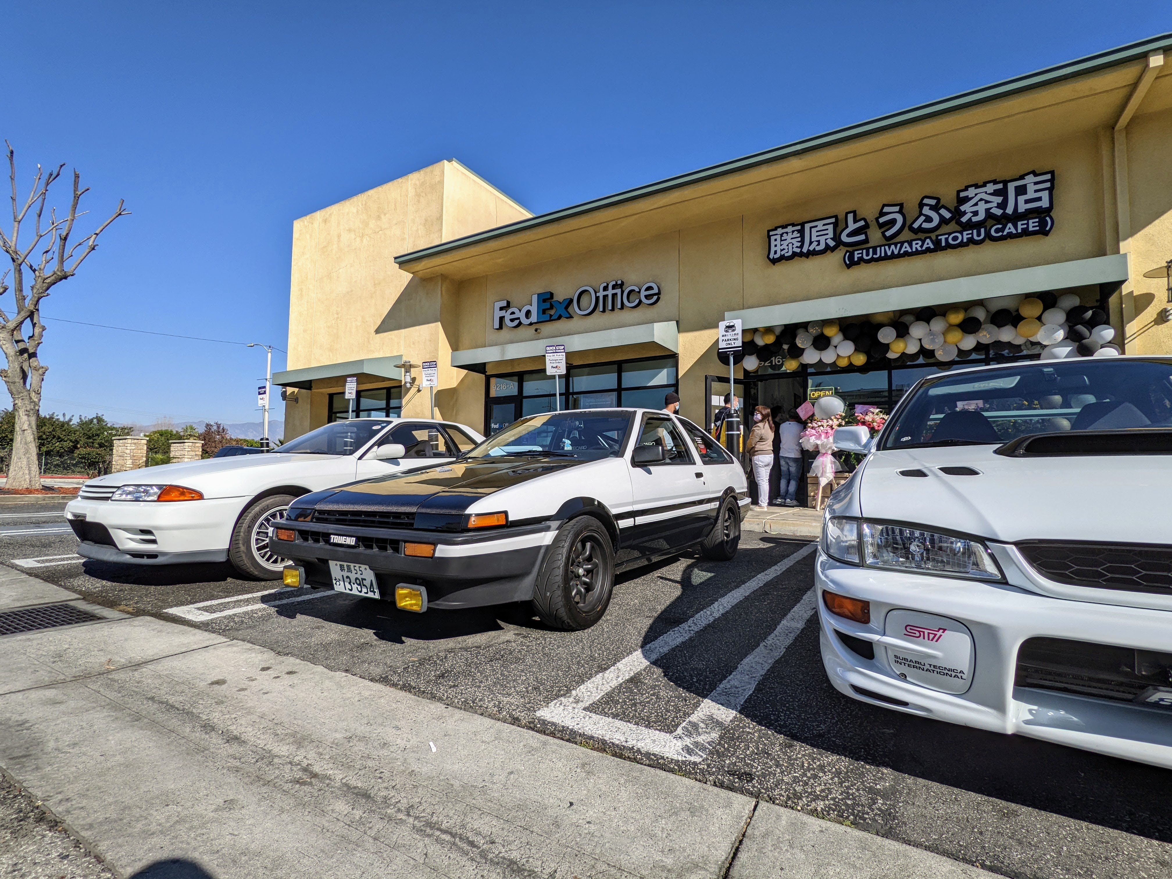 Outside Fujiwara Tofu Cafe in El Monte, with a Toyota Corolla Sprinter Trueno “AE86” parked in front.