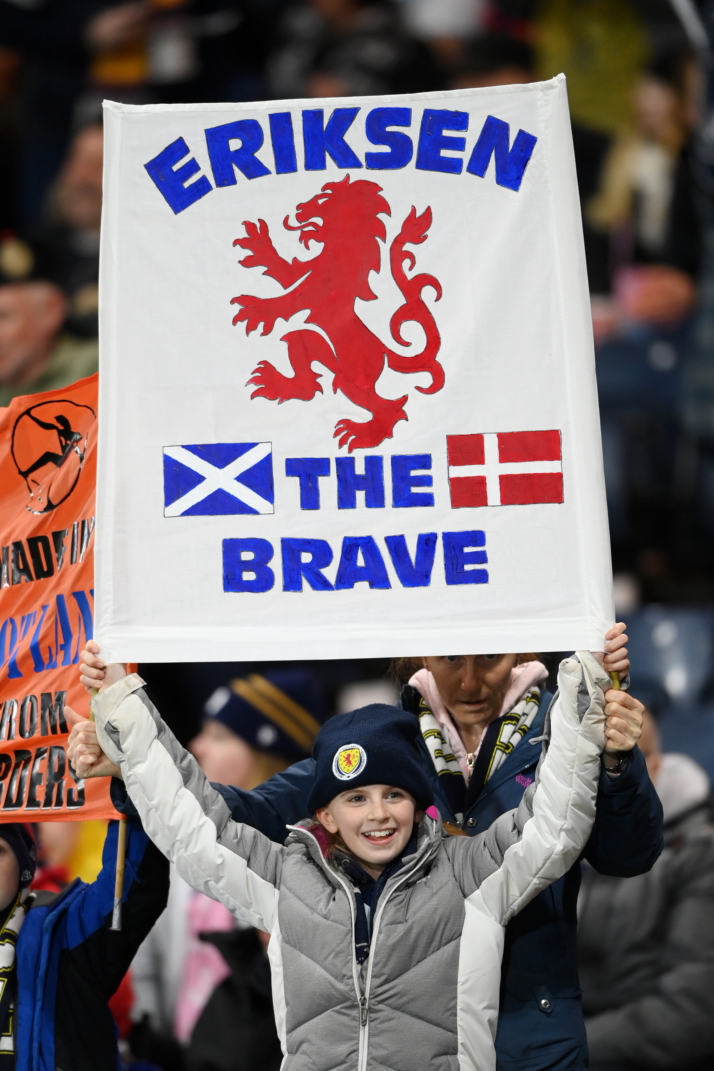 A Scotland fan holds up a sign for Christian Eriksen -  Denmark - 2022 FIFA World Cup Qualifier