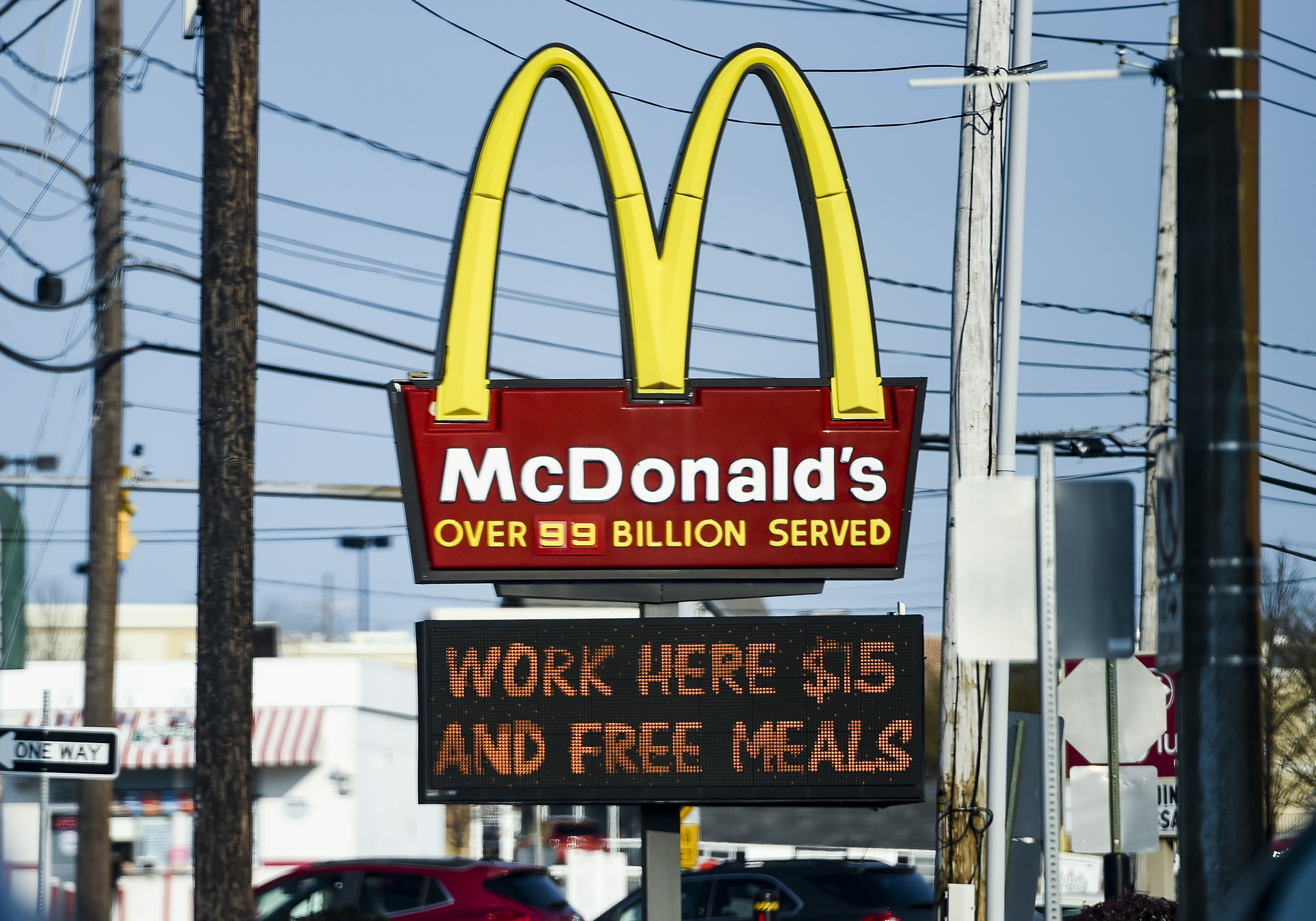 A McDonald’s sign advertising jobs for $15 an hour and free meals.