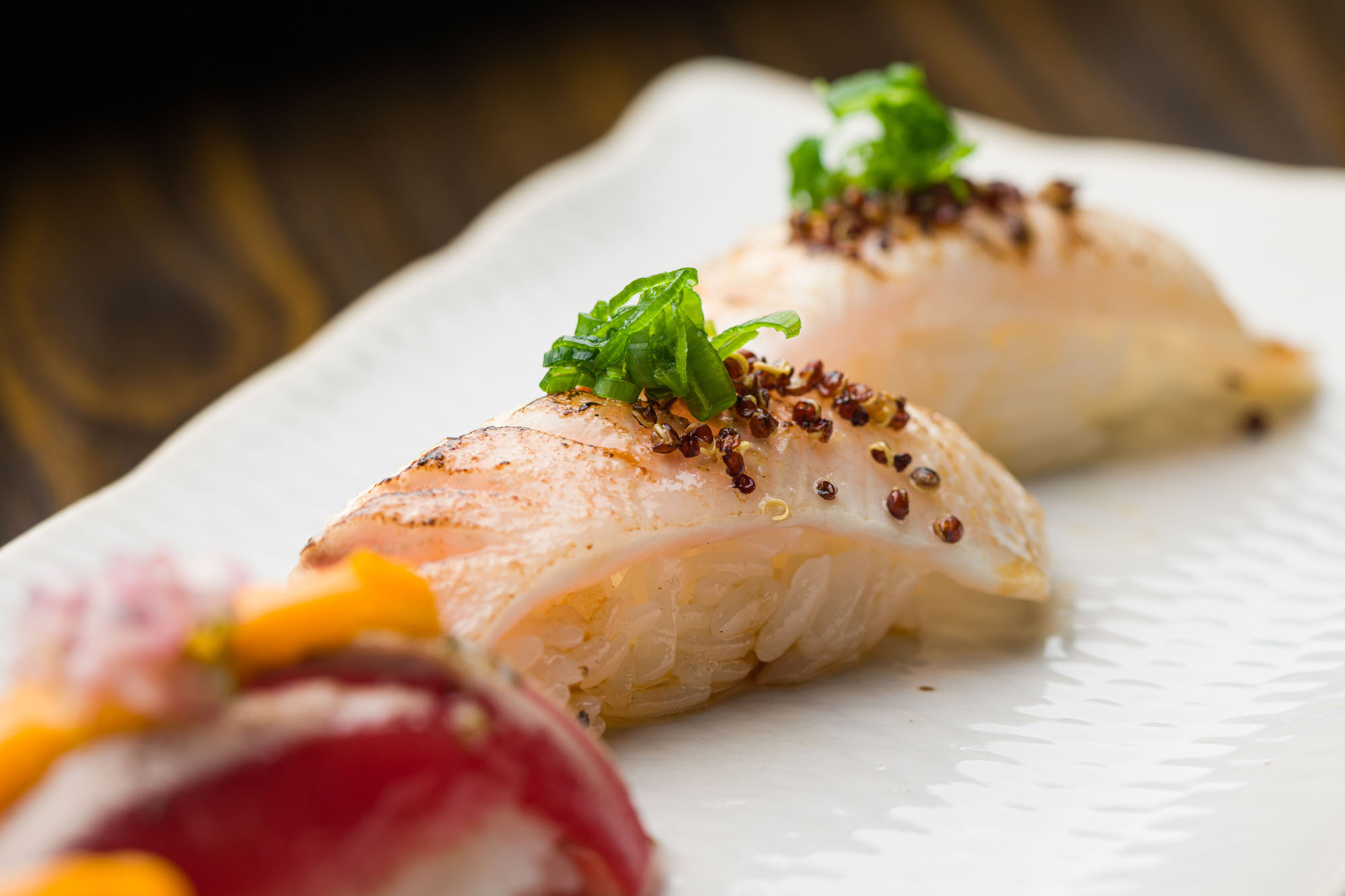 An angled image of Japanese sushi with Peruvian ingredients.