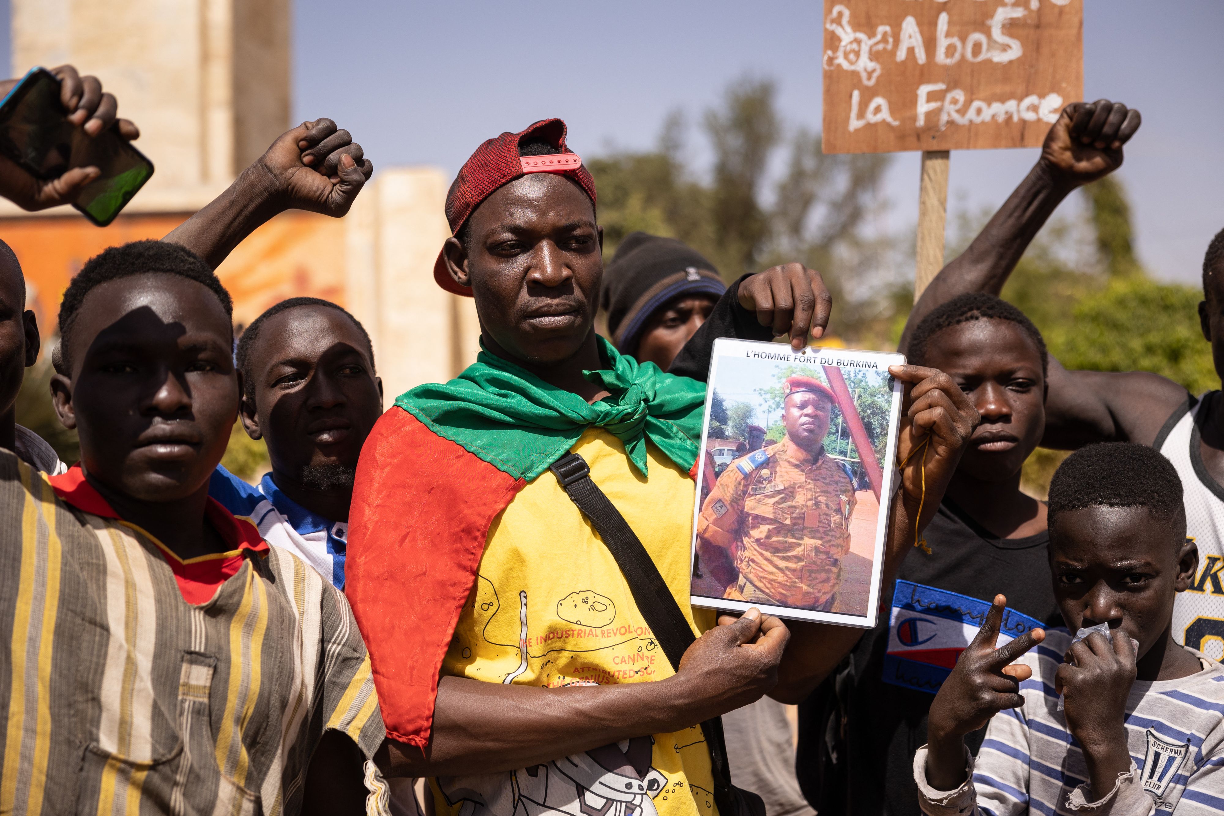 Demonstrators in Ouagadougou, Burkina Faso, hold a photo of coup leader Lt. Col. Paul-Henri Sandaogo Damiba on January 25, 2022.