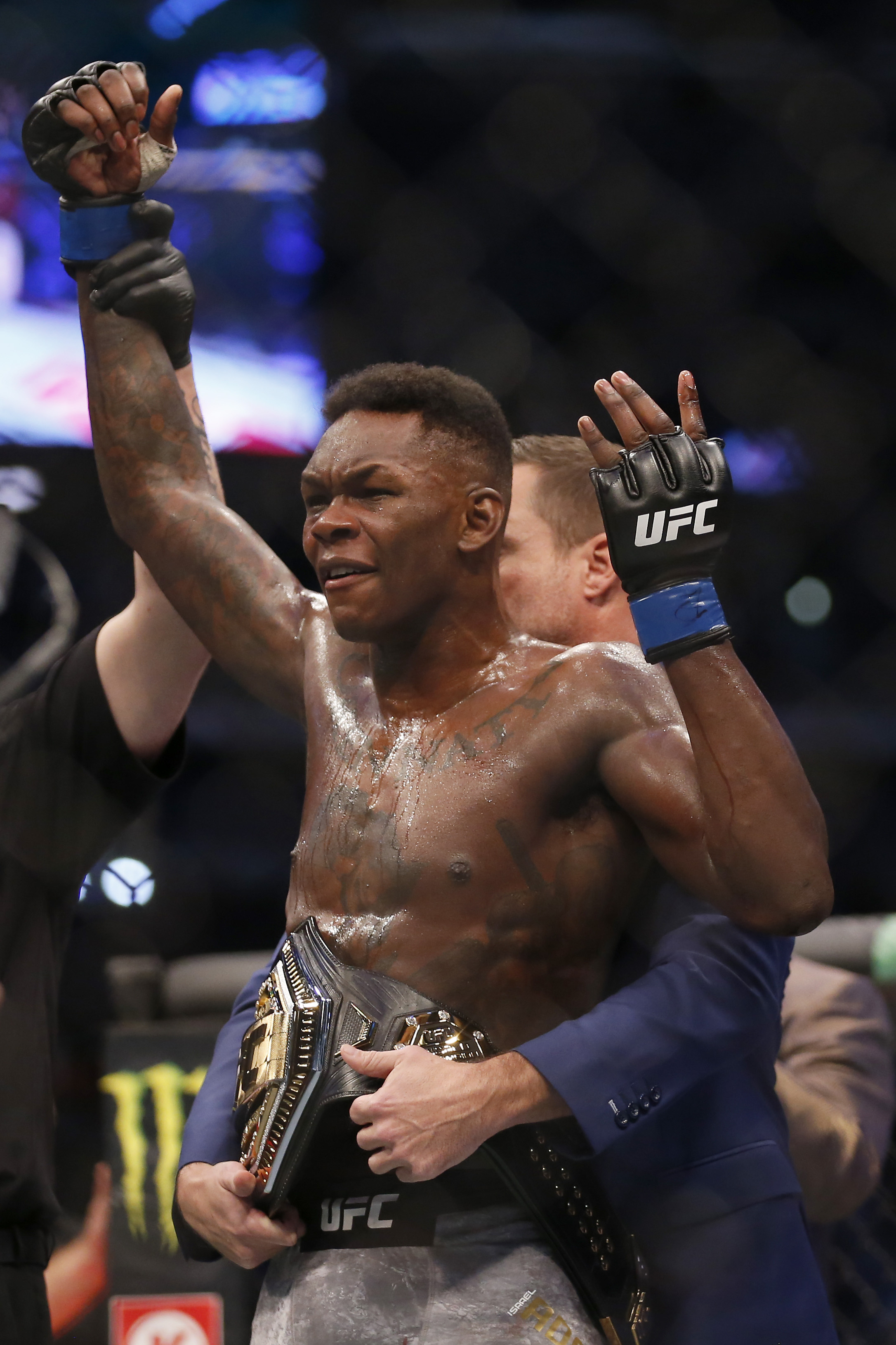 Israel Adesanya celebrates his victory over Robert Whittaker between in their Middleweight title bout during UFC 243 at Marvel Stadium on October 06, 2019 in Melbourne, Australia.