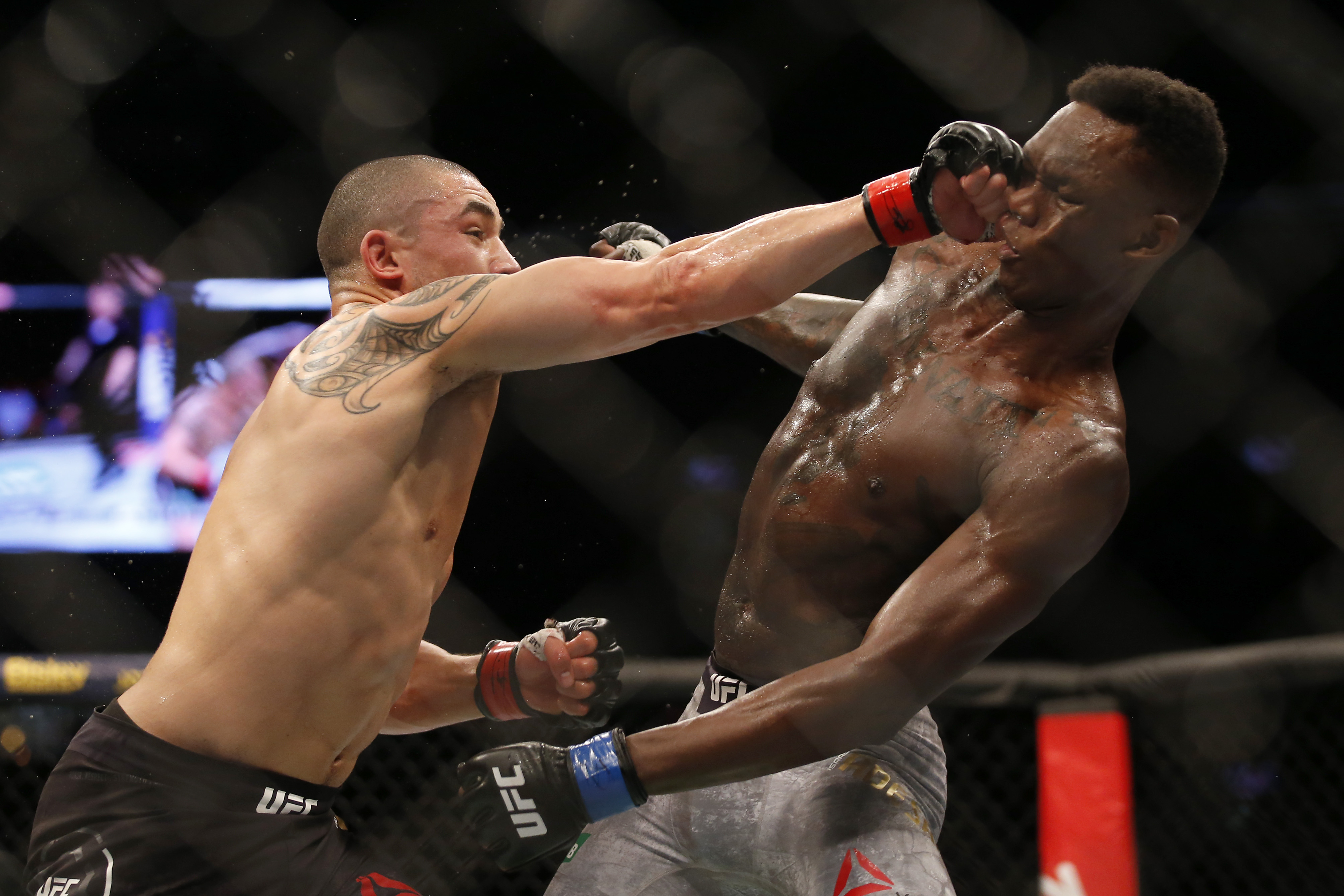 Robert Whittaker and Israel Adesanya fight in the Middleweight title bout during UFC 243 at Marvel Stadium on October 06, 2019 in Melbourne, Australia.