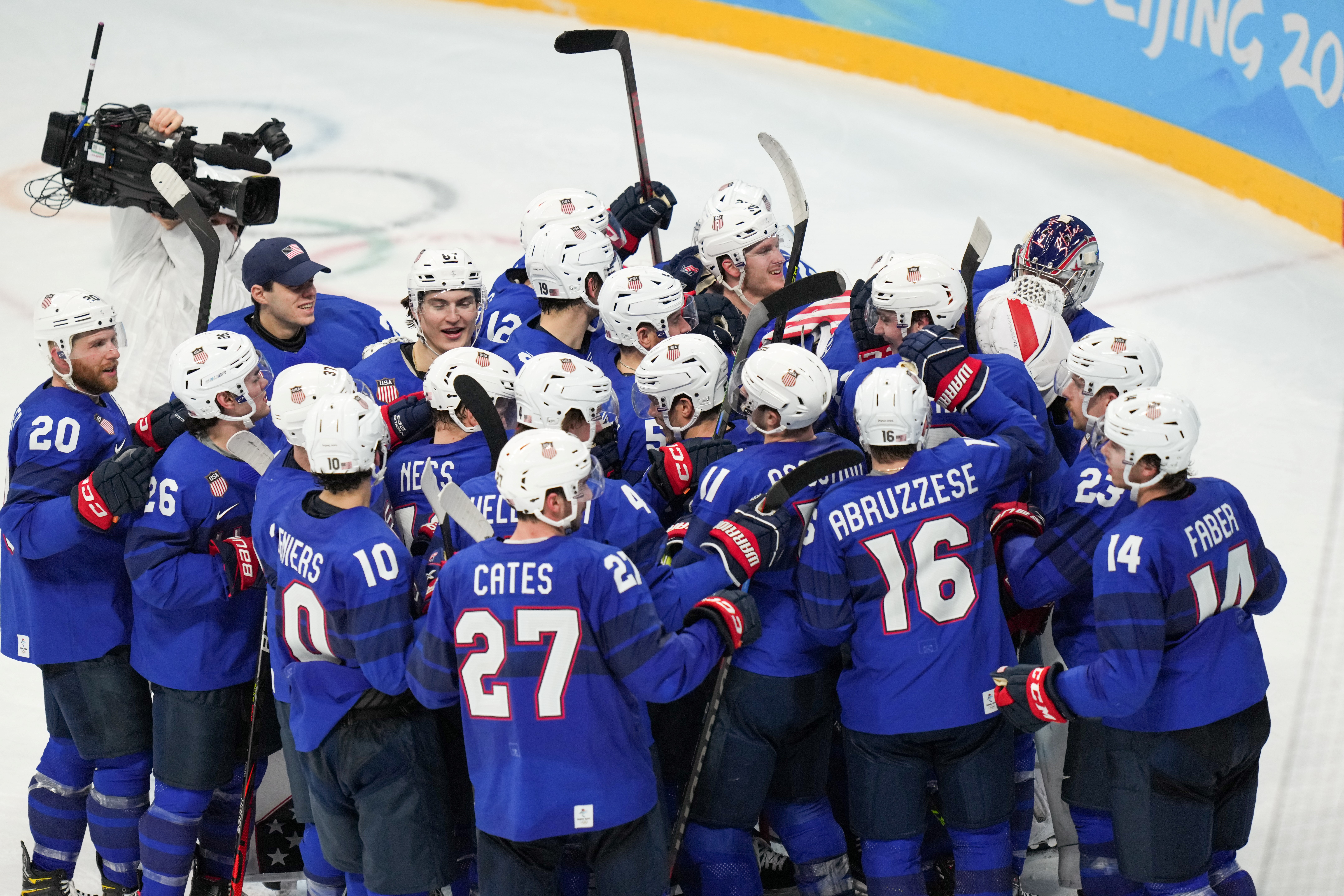 Athletes of the United States celebrate winning the ice hockey men’s preliminary round Group A match between the United States and Germany at Wukesong Sports Centre in Beijing, capital of China, Feb.13, 2022.