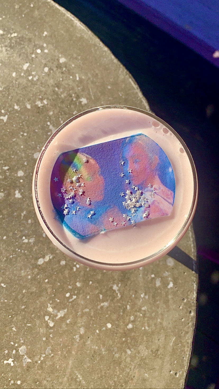 The top angle of “Bitch You’re My Soulmate” cocktail, topped with foam and a psychedelic picture of “Euphoria” characters Maddy and Cassie.