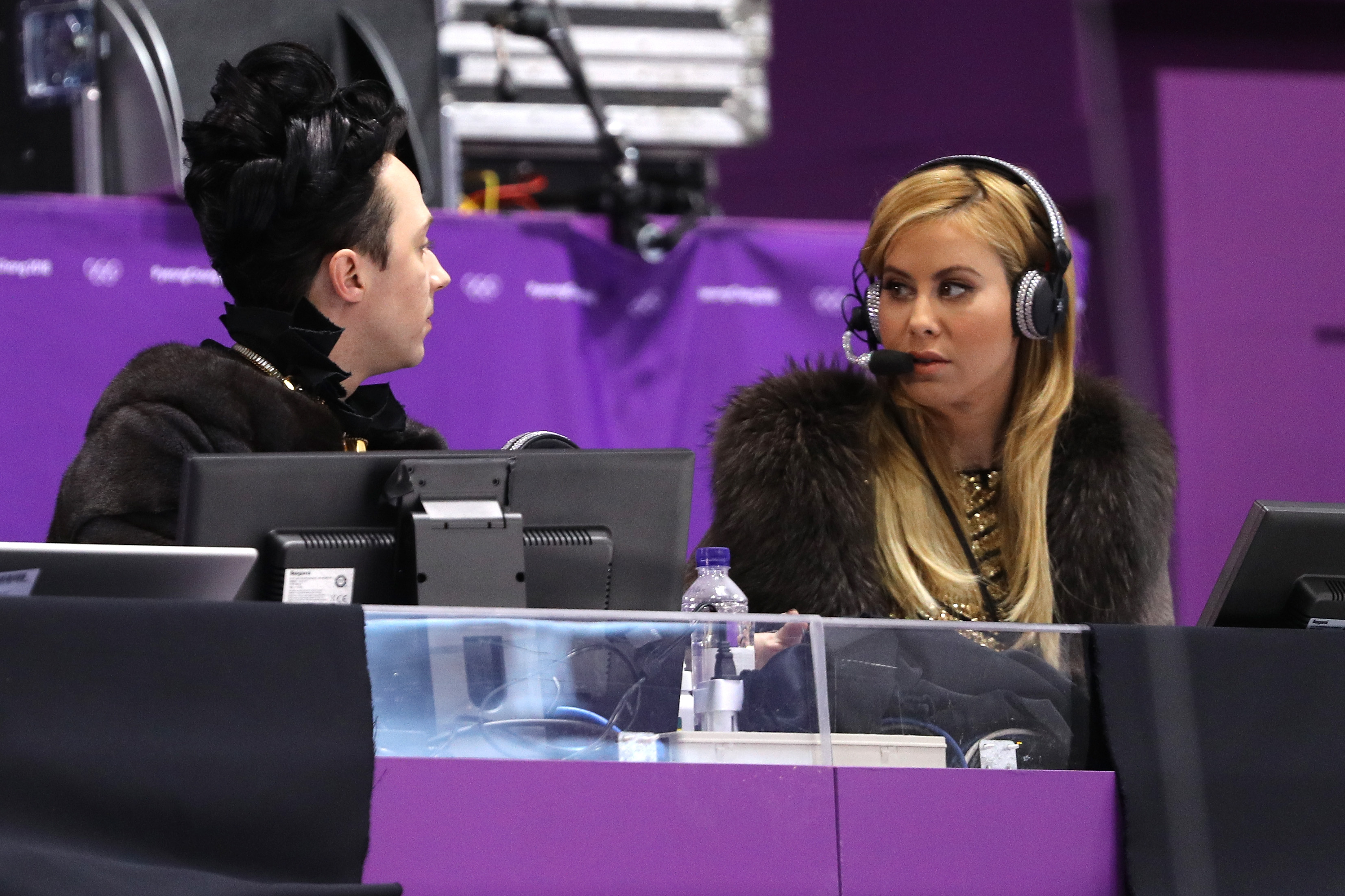 TV personalities and former figure skaters Johnny Weir and Tara Lipinski look on during the Ladies Single Skating Short Program on day twelve of the PyeongChang 2018 Winter Olympic Games at Gangneung Ice Arena on February 21, 2018 in Gangneung, South Korea.