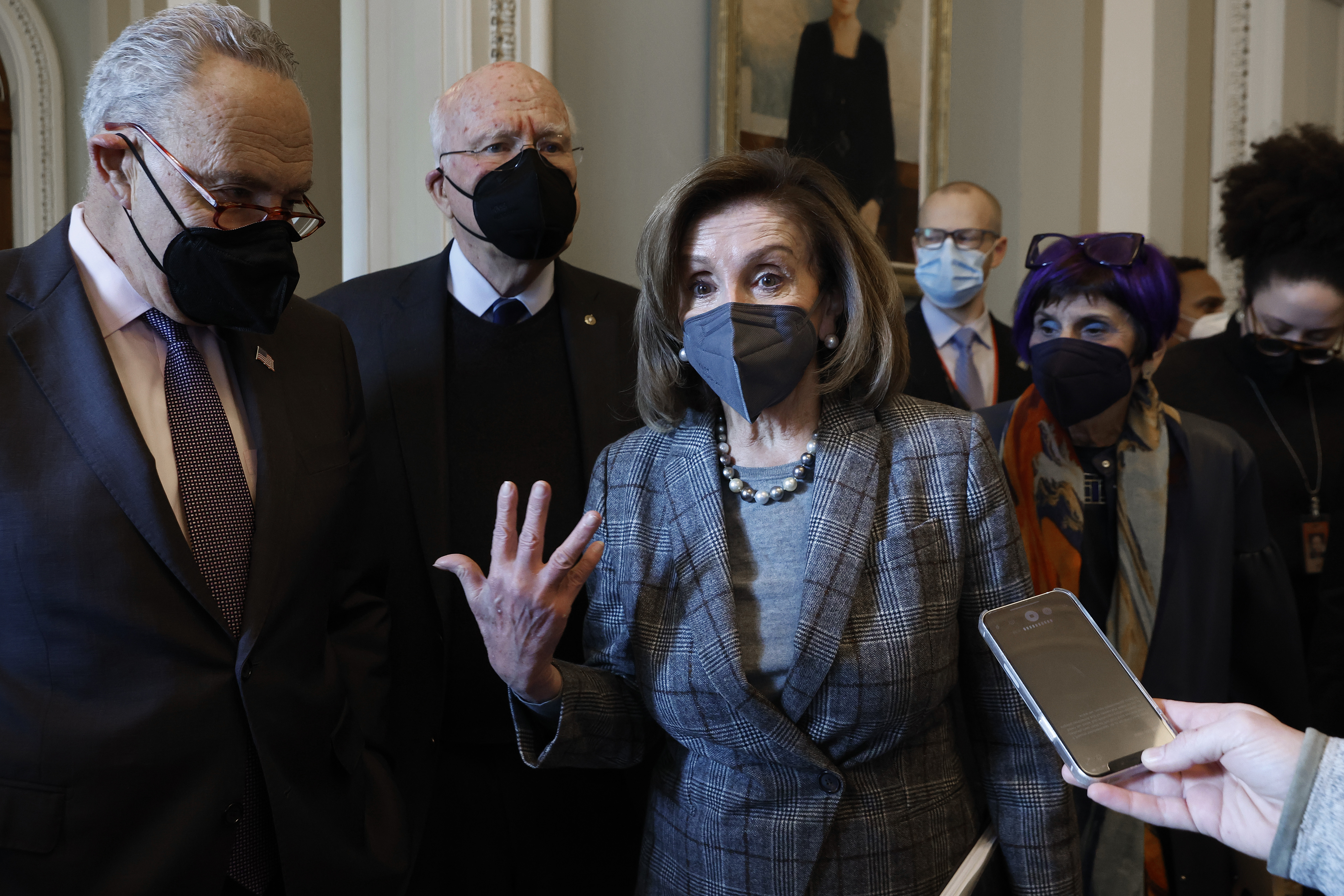 House Speaker Nancy Pelosi, flanked by Senate Majority Leader Chuck Schumer and House and Senate Appropriations Committee chairs, speaks to reporters after a meeting in the US Capitol on February 1, 2022, in Washington, DC.