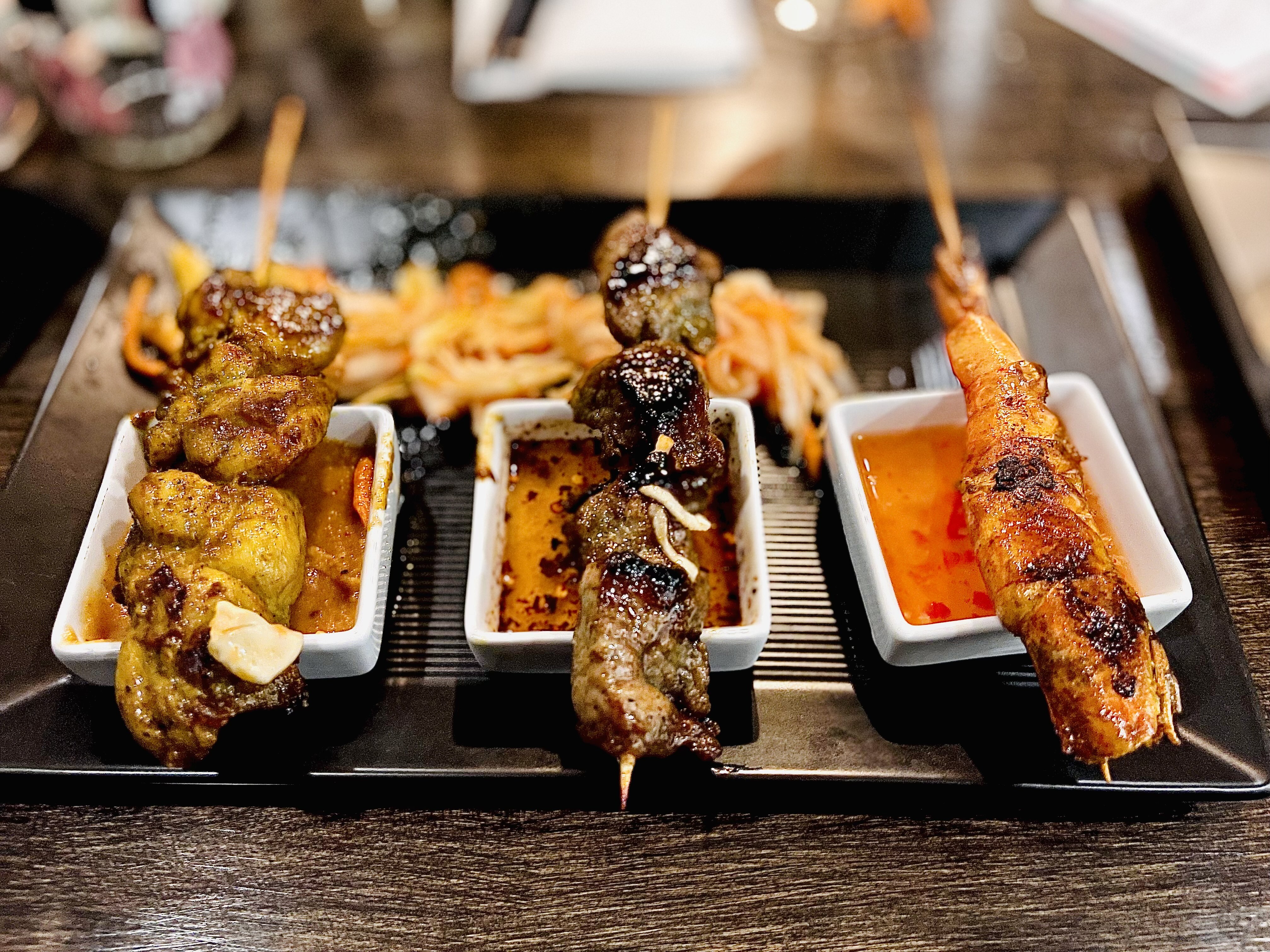Skewers and condiments at Sticx.