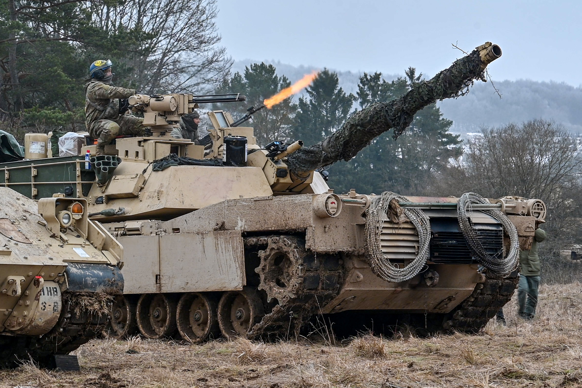 US soldiers fire from an M1 Abrams main battle tank during an international military exercise in Bavaria, Germany.