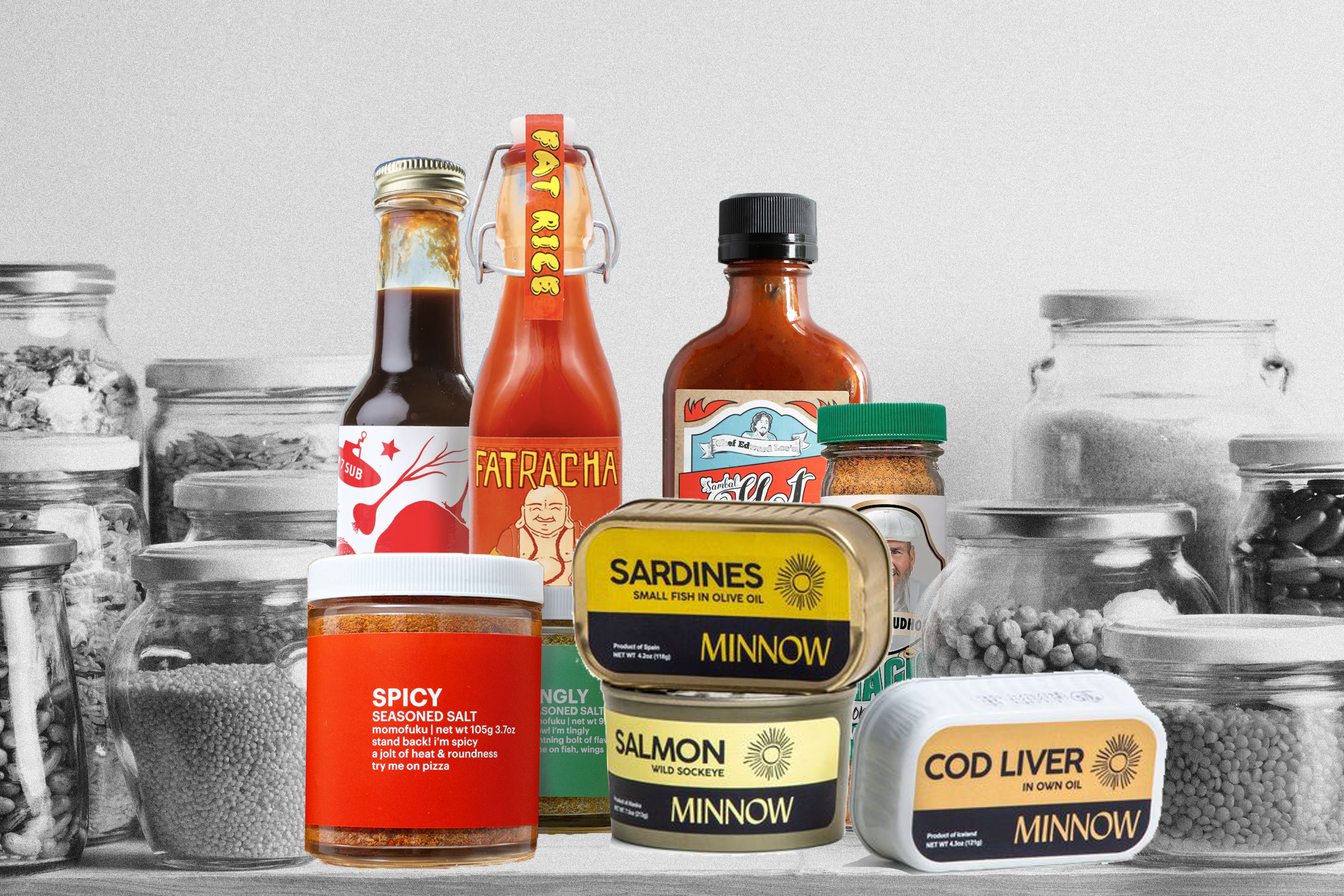 A collection of restaurant-sold pantry products, including chile crisp and tinned fish, on gray-scaled pantry shelf