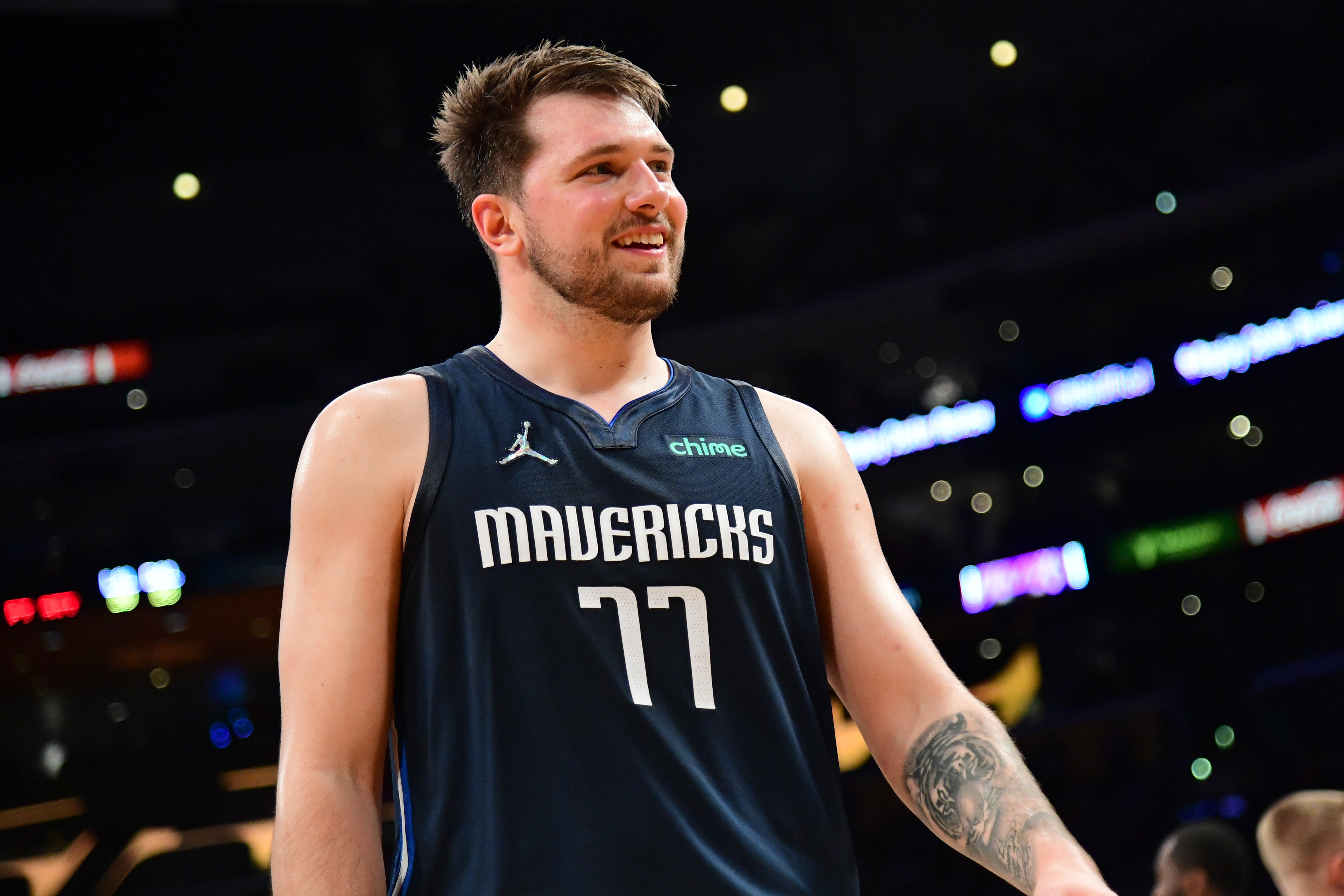 Luka Doncic #77 of the Dallas Mavericks smiles during the game against the Los Angeles Lakers on March 1, 2022 at Crypto.Com Arena in Los Angeles, California.