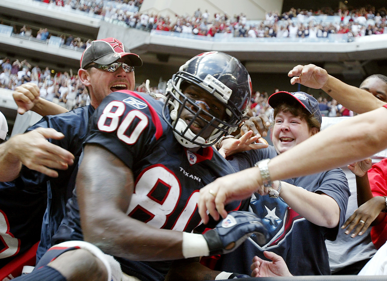 Jerry Holt/Star Tribune Houston TX Vikings at Texans 10/10/04 #89807------Andre Johnson was the bright spot in Houstons offense her he clebrates with fans after tying the game in the 4th quarter during Sunday aftenoon NFL action at Relaiant Stadium in Ho