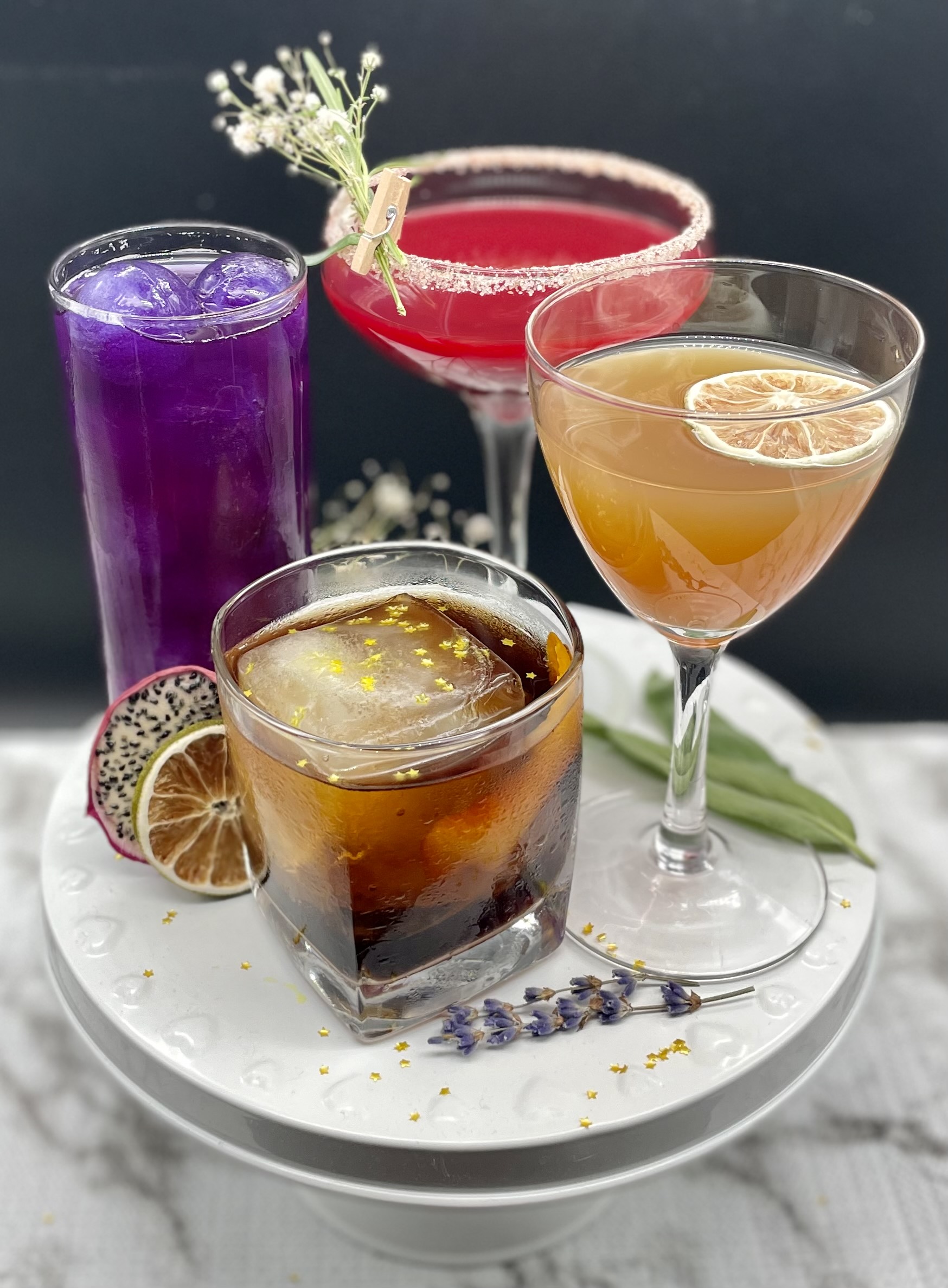 Four brightly colored non-alcoholic cocktails made by Lissa Eubanks and Savanah Rainey of upcoming zero-proof bottle shop and bar Zlich Market in Atlanta.