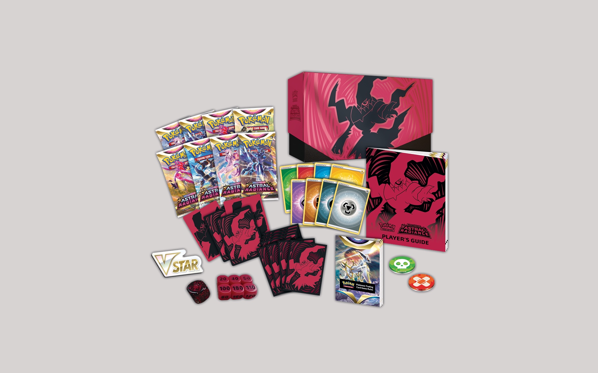 an image of a card packs laid out. there are coins and a binder with pokemon art on it.