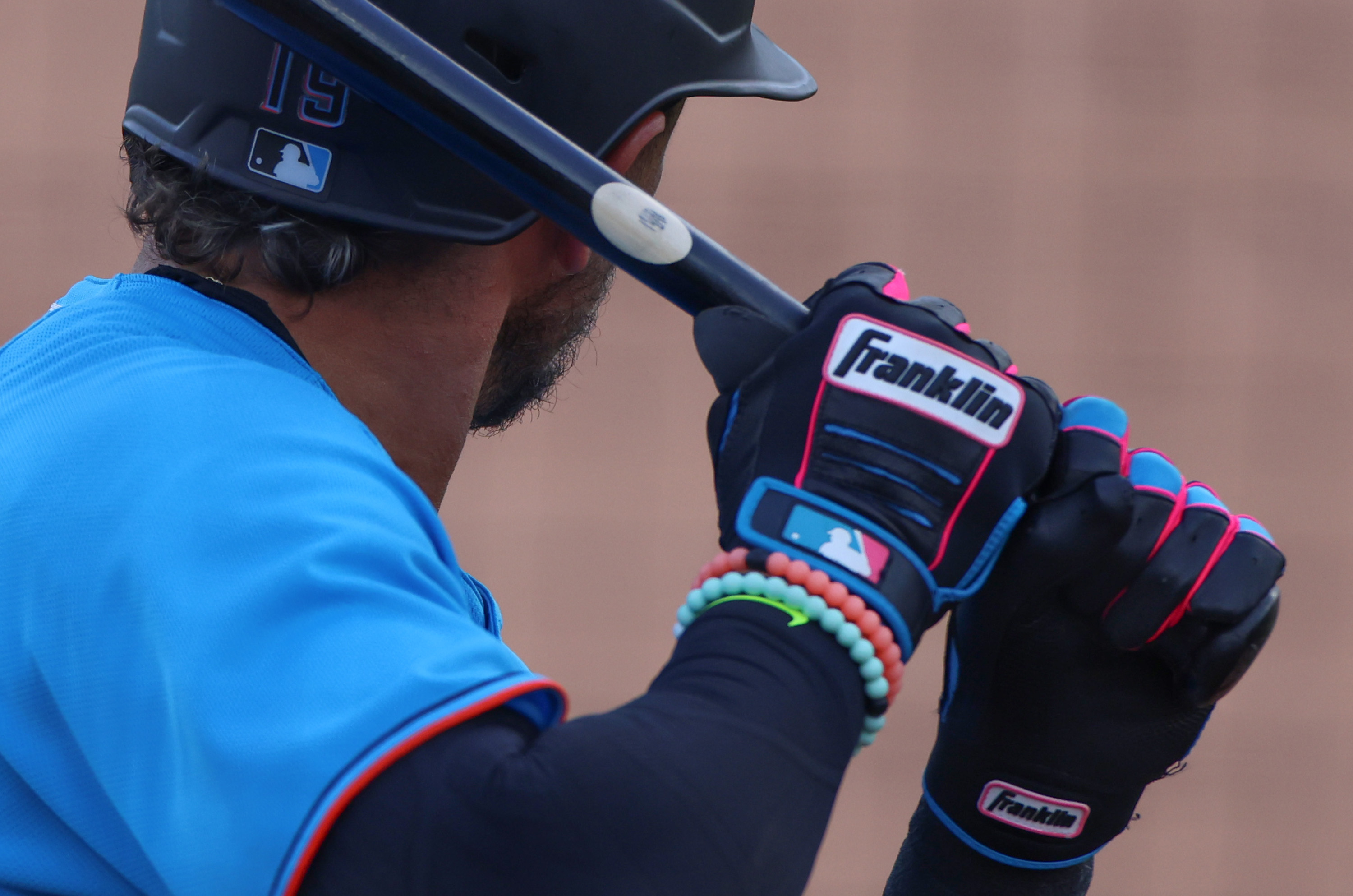 A detailed view of the Franklin batting gloves worn by Miguel Rojas #19 of the Miami Marlins against the St. Louis Cardinals in a spring training game at Roger Dean Chevrolet Stadium