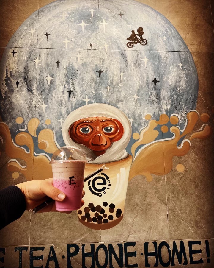 E.T. sitting in a boba cup