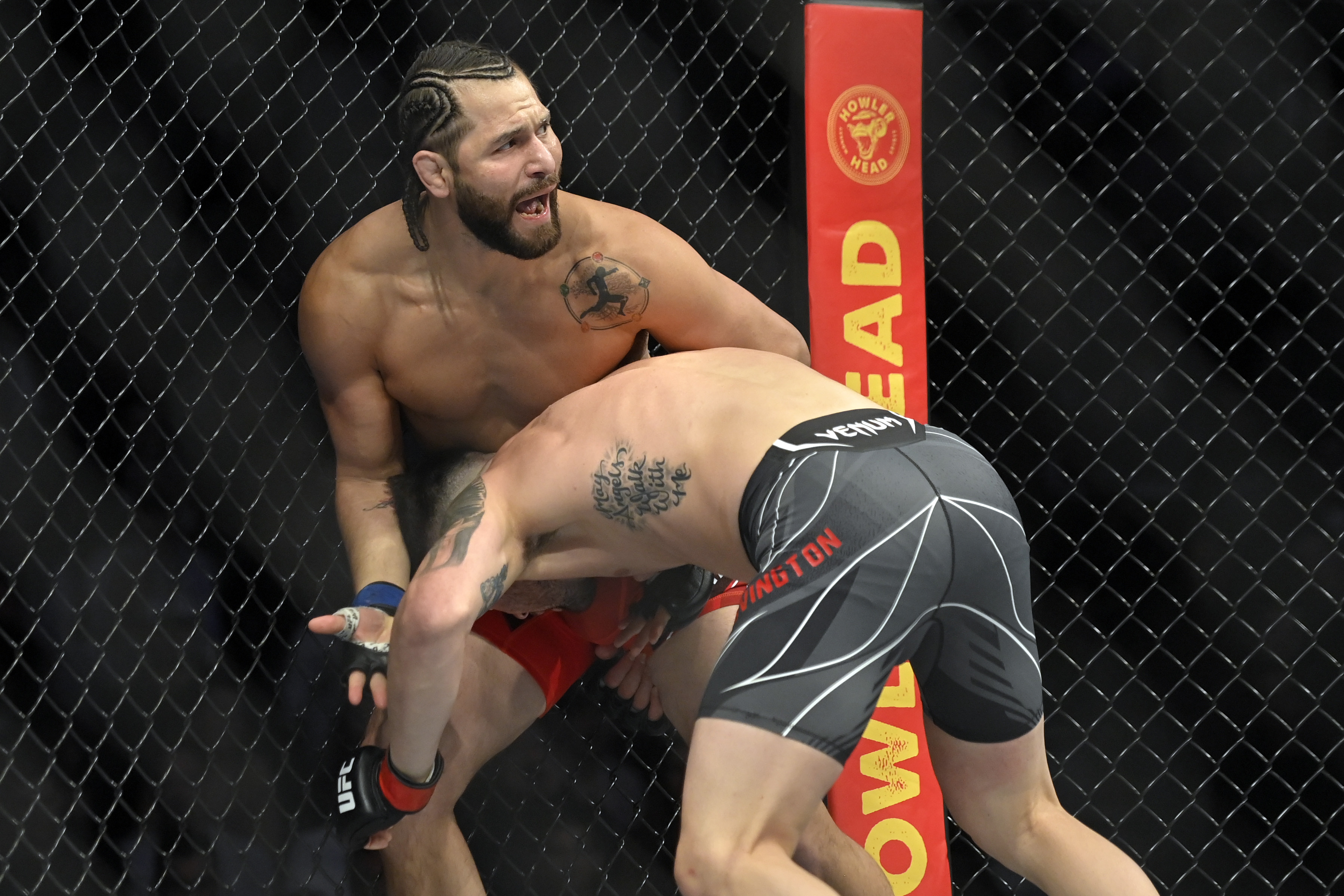 Jorge Masvidal complains about an eye poke to referee Herb Dean at UFC 272. 