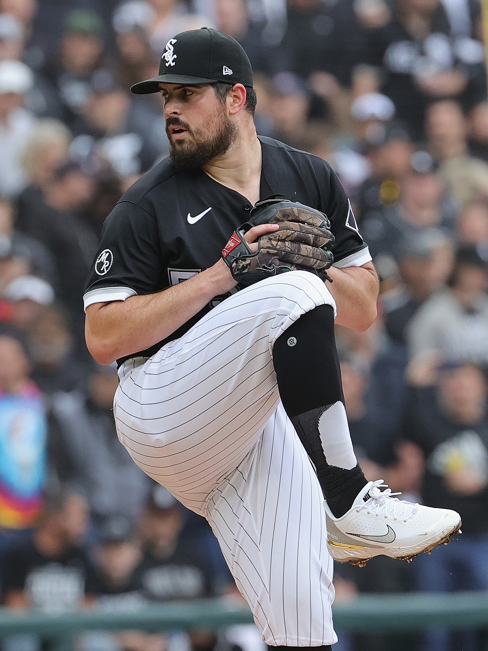 Starting pitcher Carlos Rodon #55 of the Chicago White Sox delivers the ball against the Houston Astros at Guaranteed Rate Field on October 12, 2021 in Chicago, Illinois. The Astros defeated the White Sox 10-1.