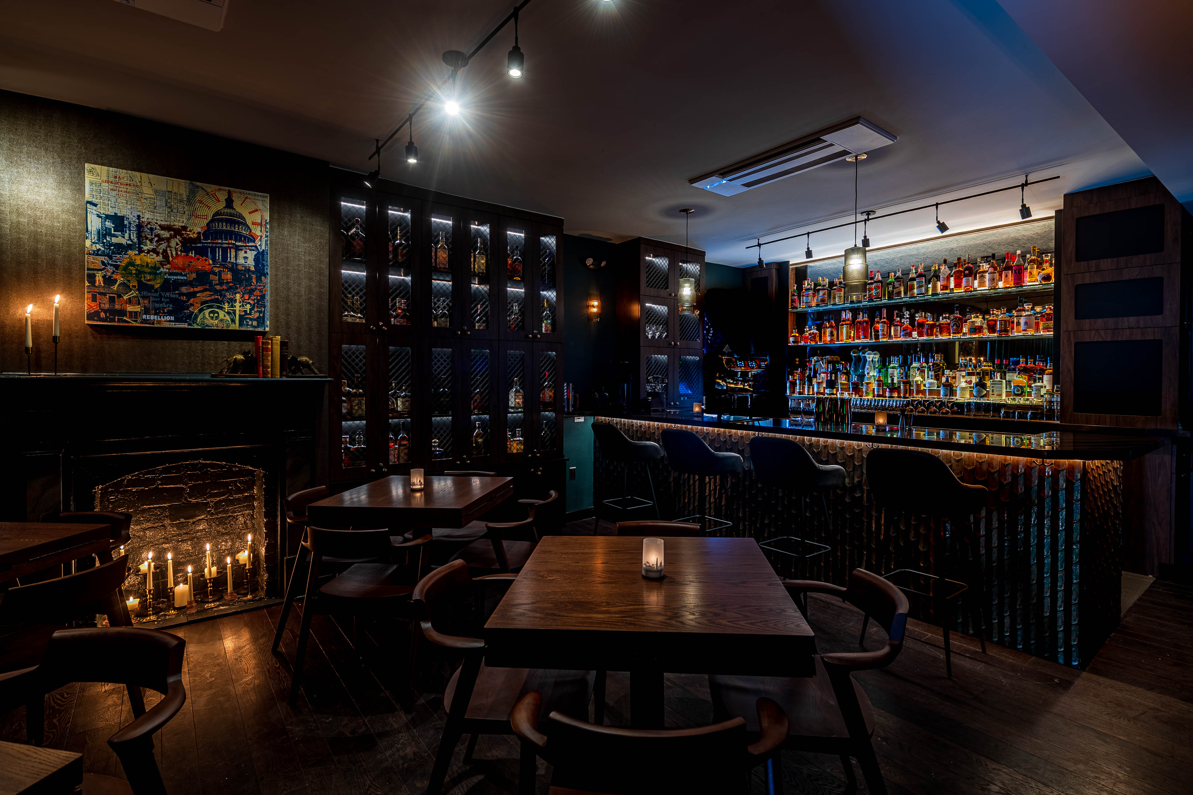 A glowing bar lined with lockers and spirits