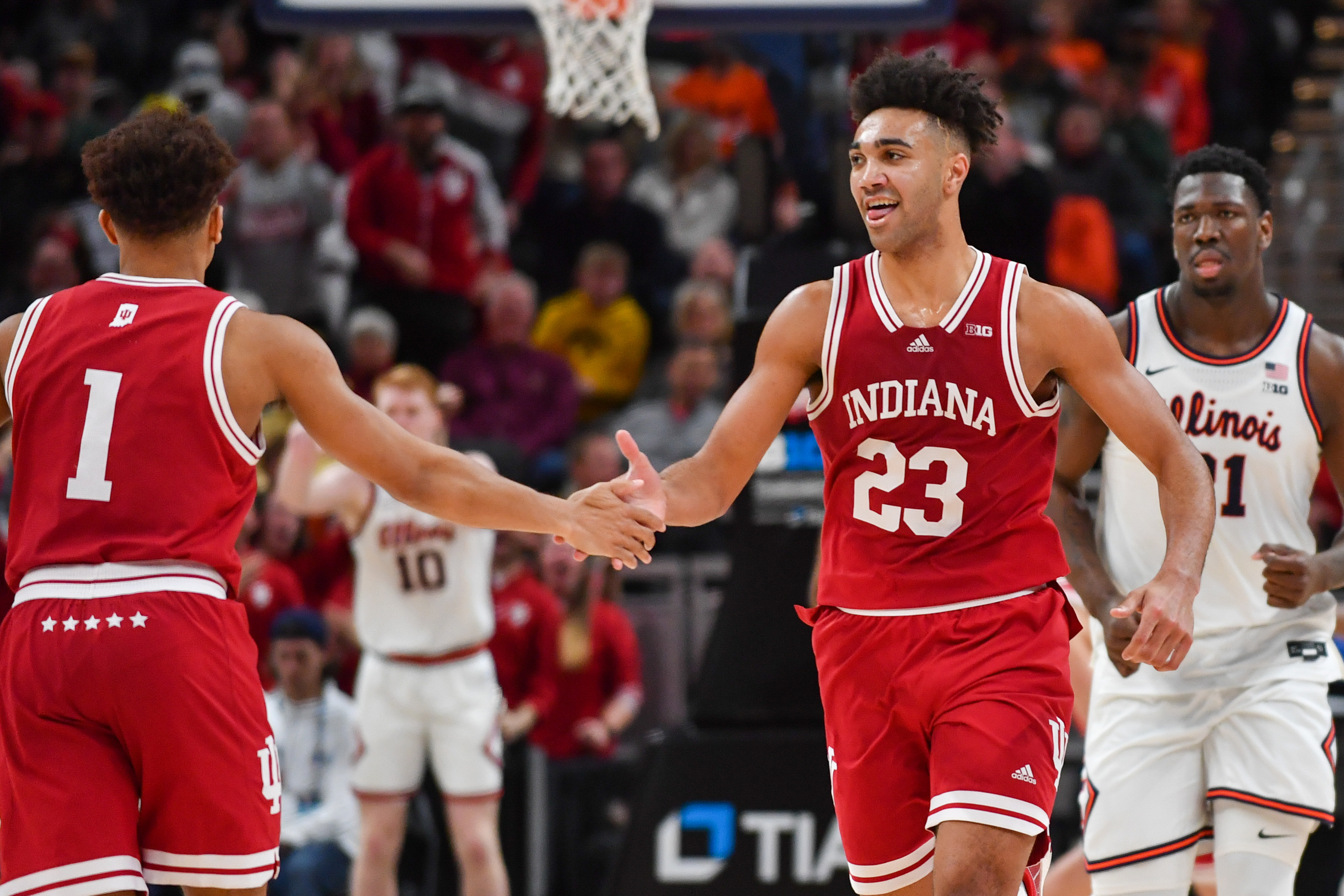 Trayce Jackson-Davis #23 of the Indiana Hoosiers reaches out in celebration with Rob Phinisee #1