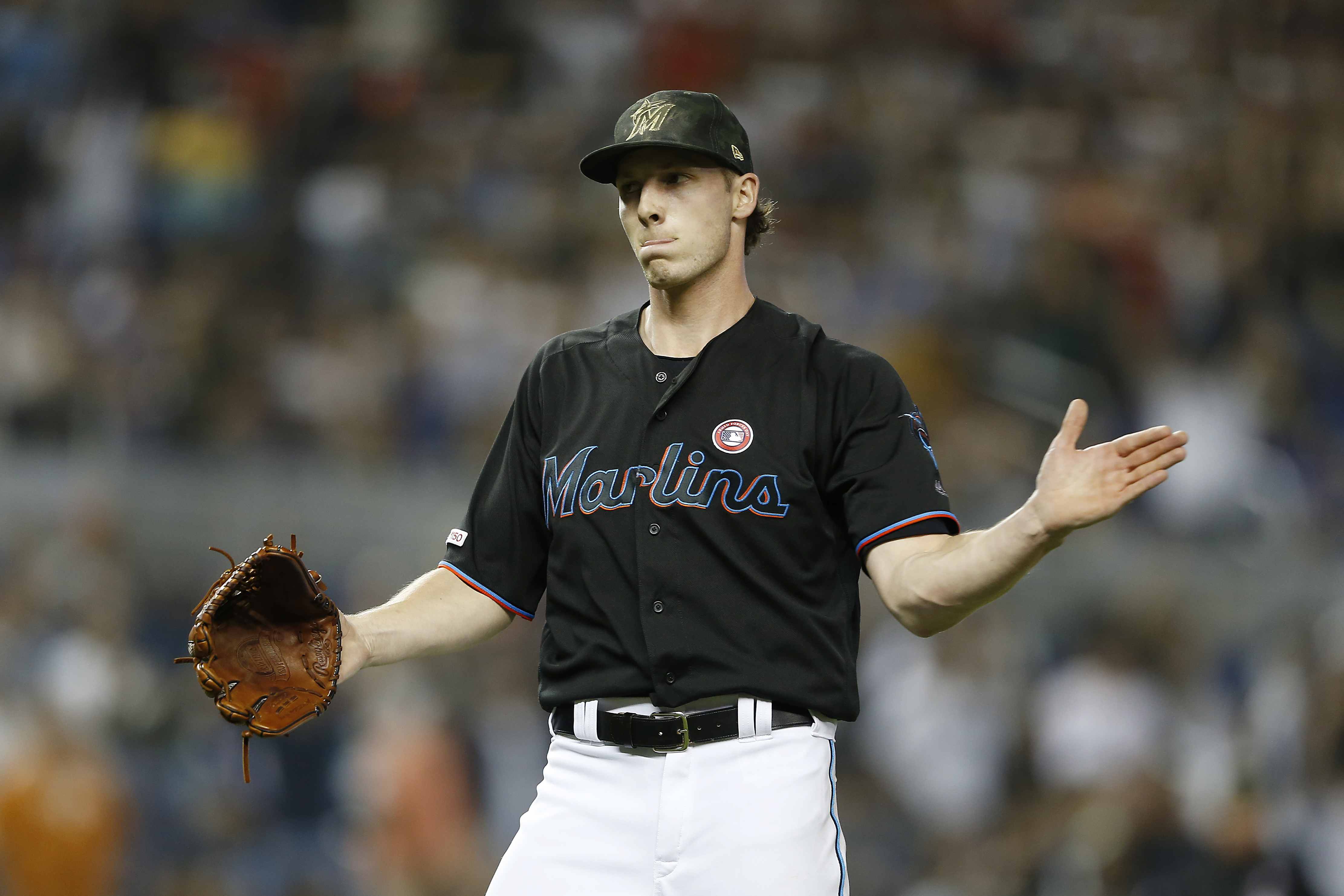 Adam Conley #61 of the Miami Marlins reacts after defeating the New York Mets 2-0 at Marlins Park