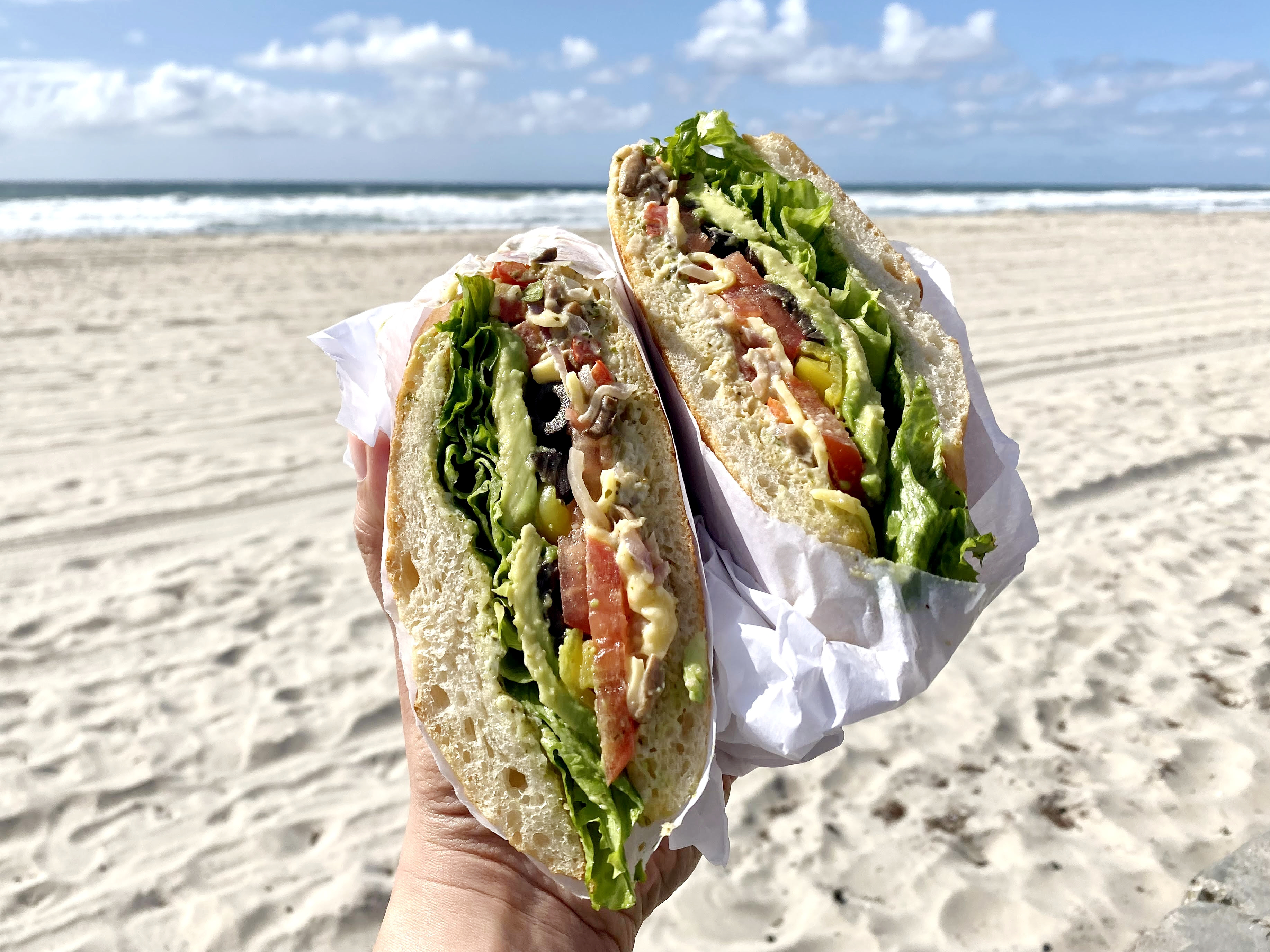 Mushroom sandwich against beach background.