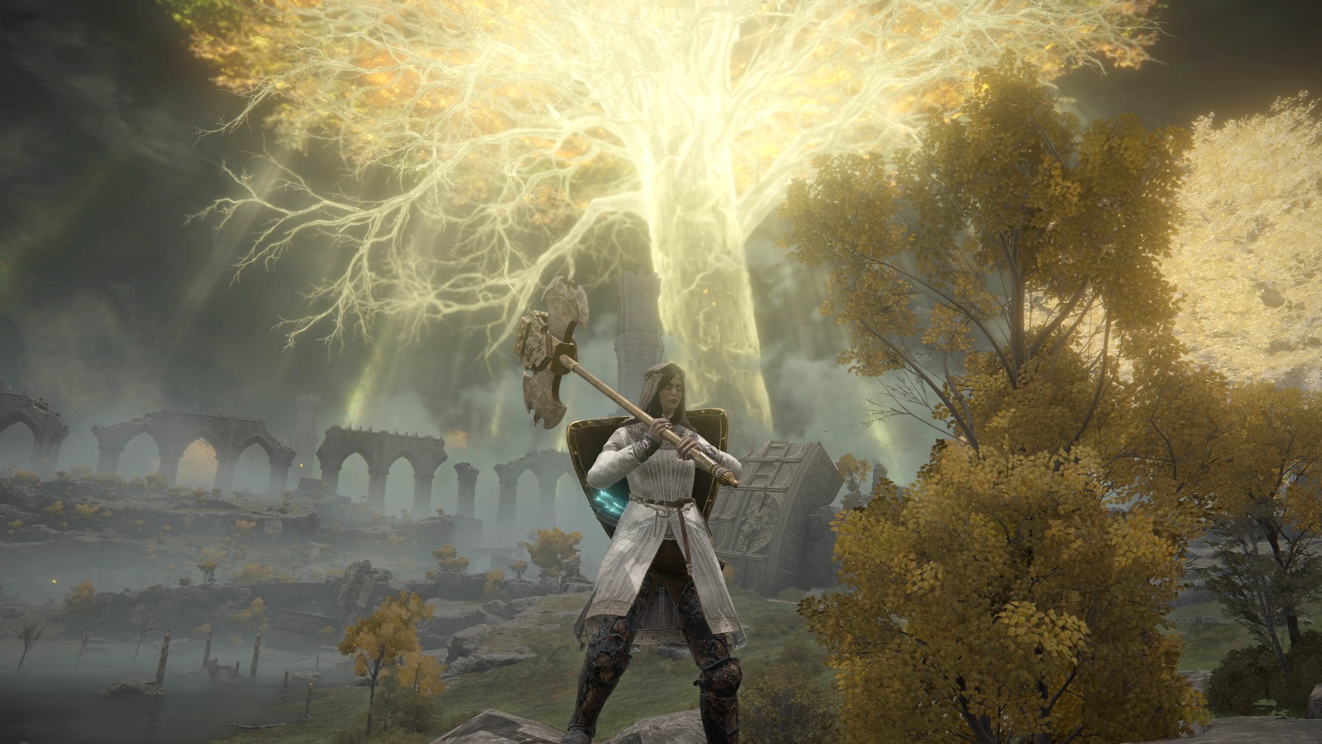 A Tarnished wields a giant ax two-handed in a screenshot from Elden Ring