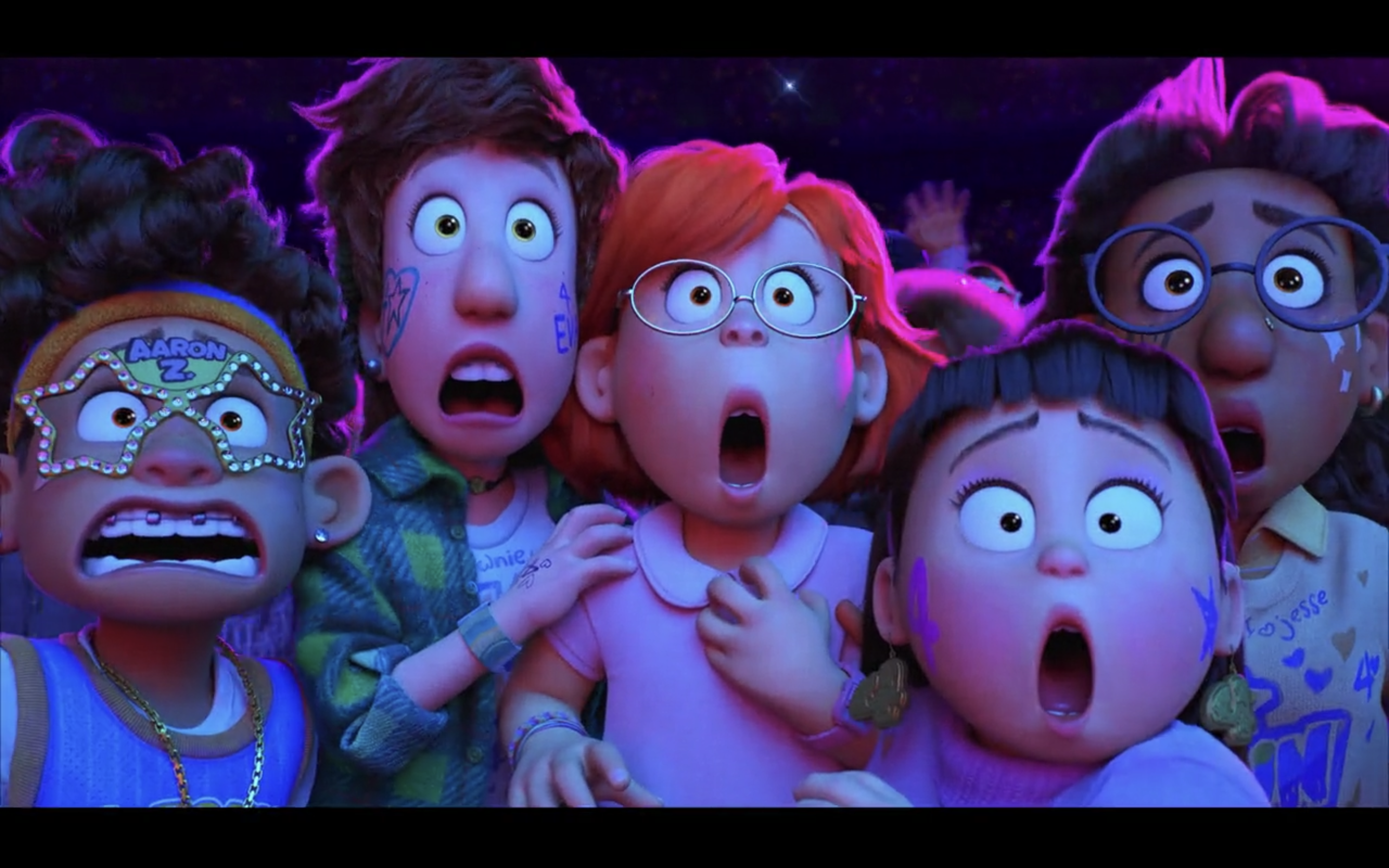 A still from the animated film “Turning Red,” showing five teen kids with mouths open, reacting broadly to something.