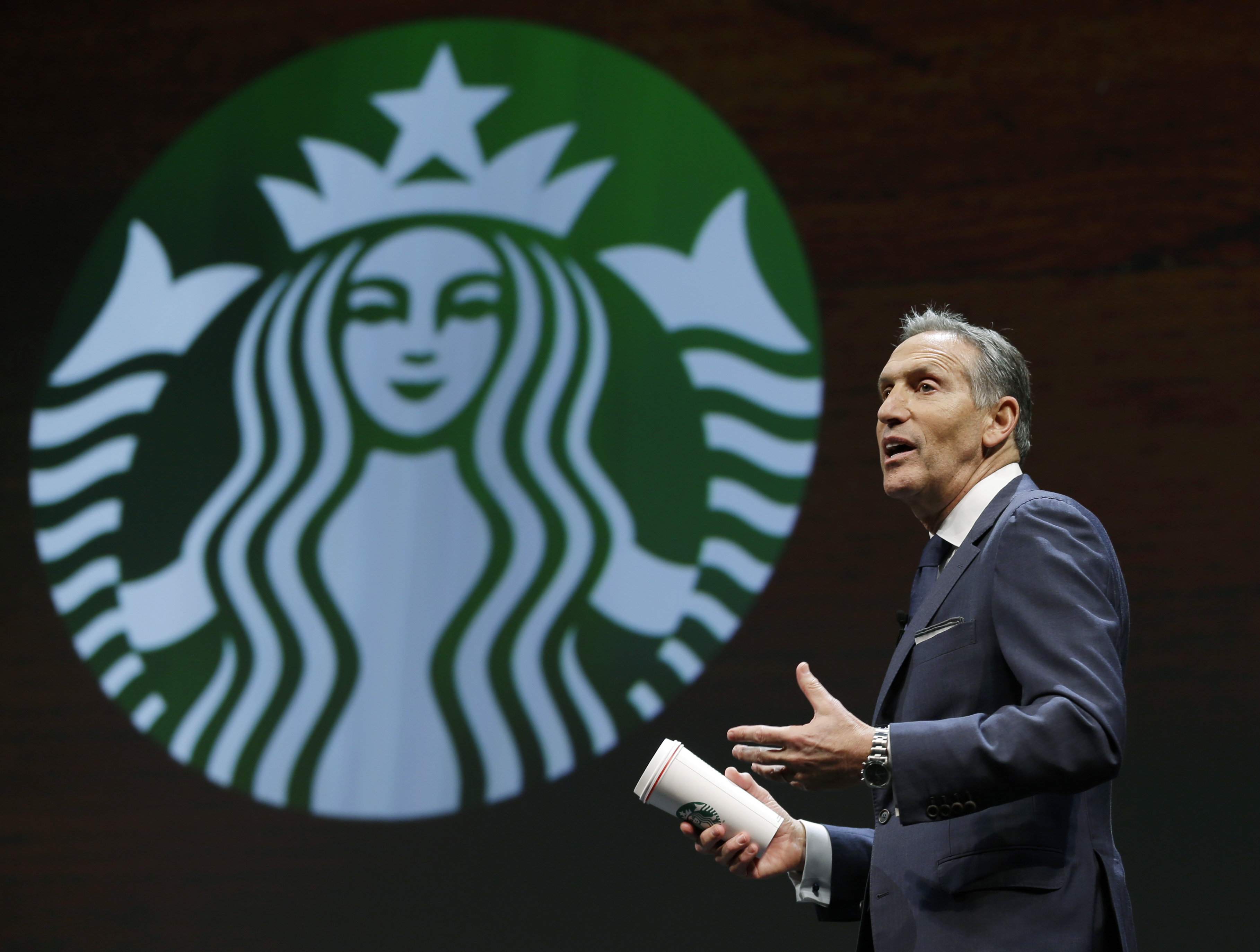 Howard Schultz and the Starbucks logo 