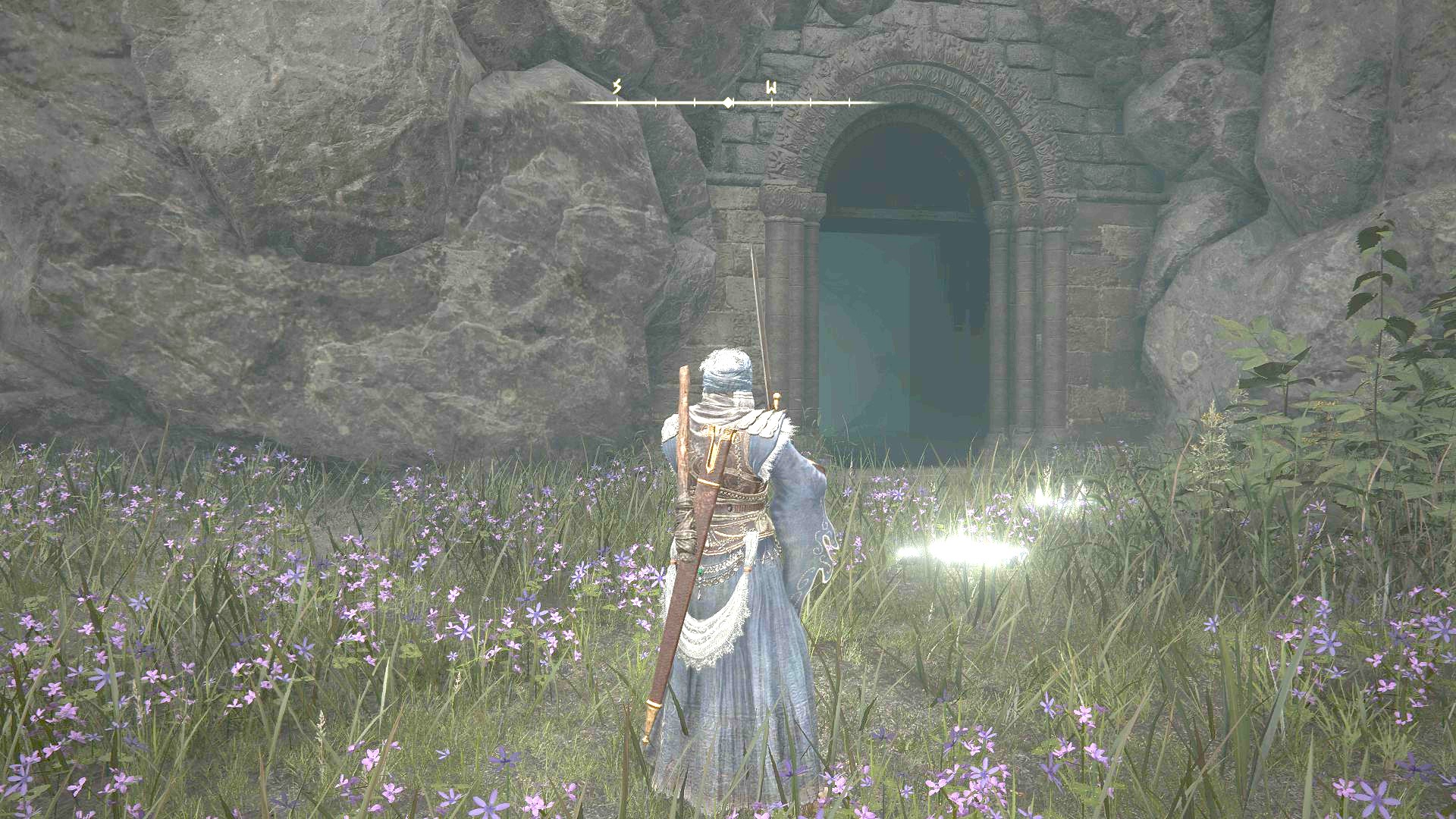 Standing outside of the entrance to Murkwater Catacombs in Elden Ring