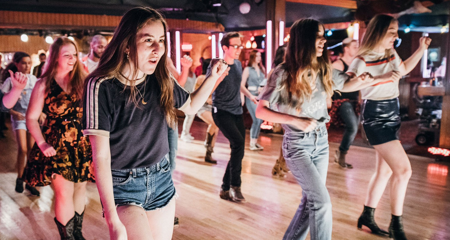 A still from Haim’s music video. They’re line-dancing.